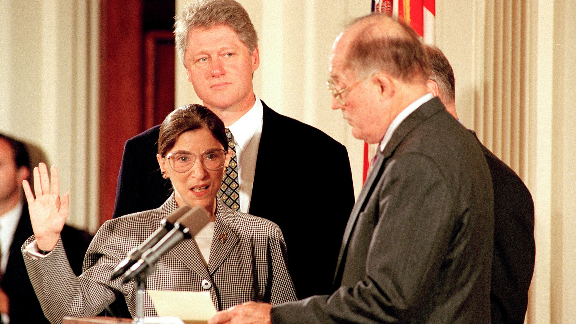 Supreme Court Chief Justice William Rehnquist, right, administers the oath to defend the Constitution to Ruth Bader Ginsburg as President Bill Clinton looks on in the East Room of the White House in Washington, D.C., Tuesday, Aug. 10, 1993. (AP Photo/Barry Thumma)