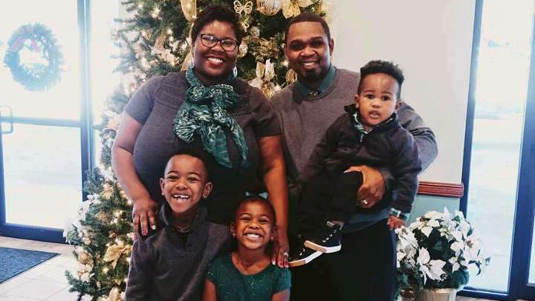 The Shaw family at Christmas: LaKenya, 38, Allen, 39, Josiah, 7, Naomi, 5, and Matthew, 2,