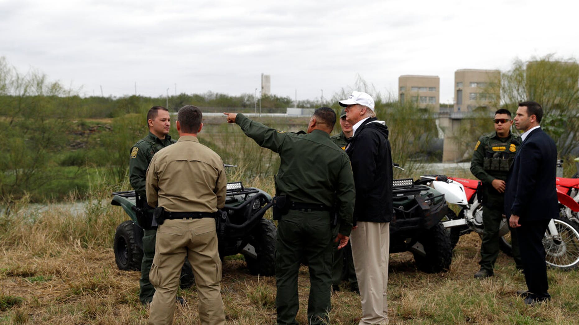 President Donald Trump tours the U.S. border with Mexico at the Rio Grande on the southern border, Thursday, Jan. 10, 2019, in McAllen, Texas. (AP Photo/ Evan Vucci)