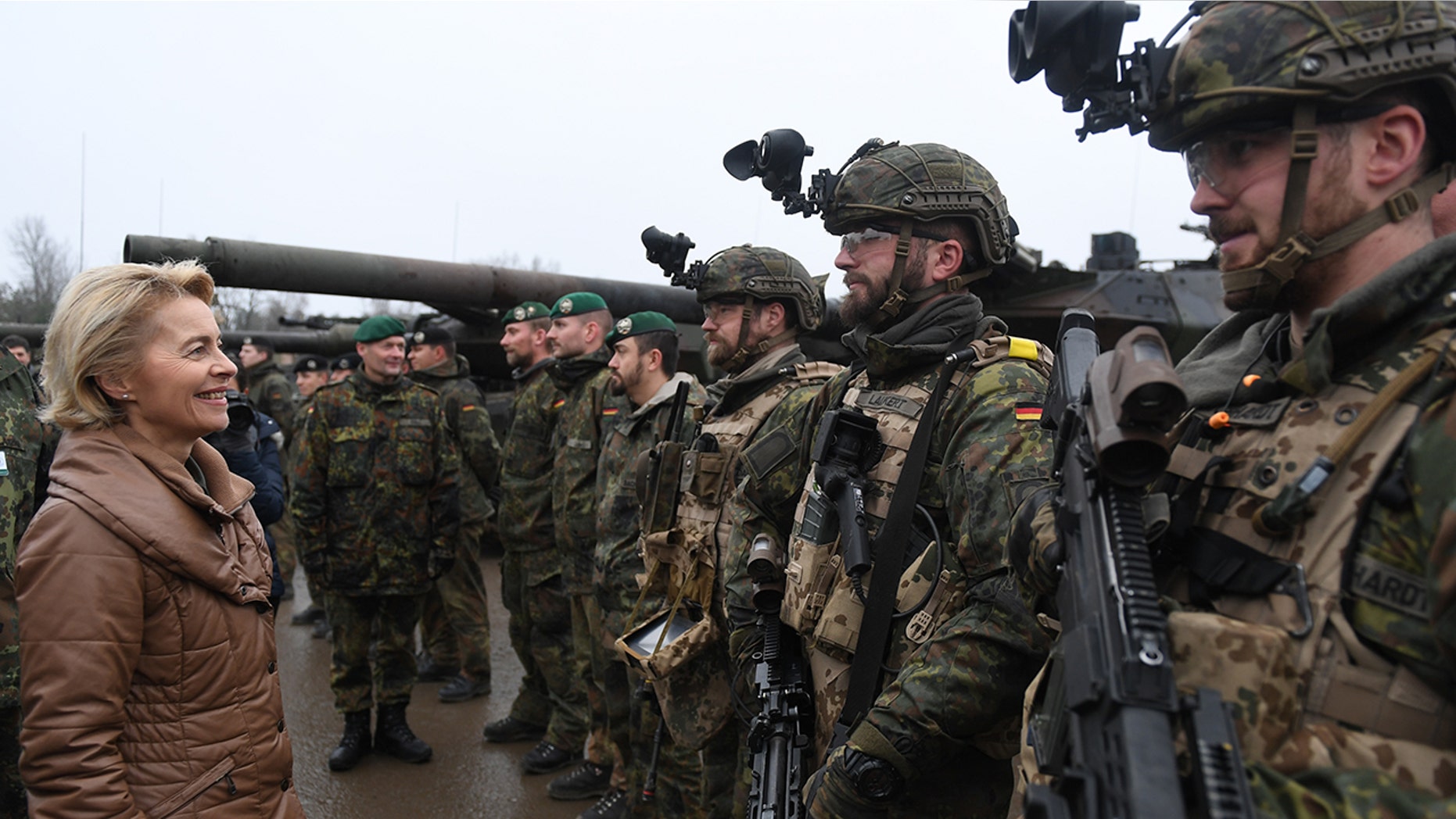 German Defense Minister Ursula von der Leyen chats with soldiers of the Bundeswehr during a visit to a Bundeswehr infantry training facility on December 6, 2018 in Munster, Germany.