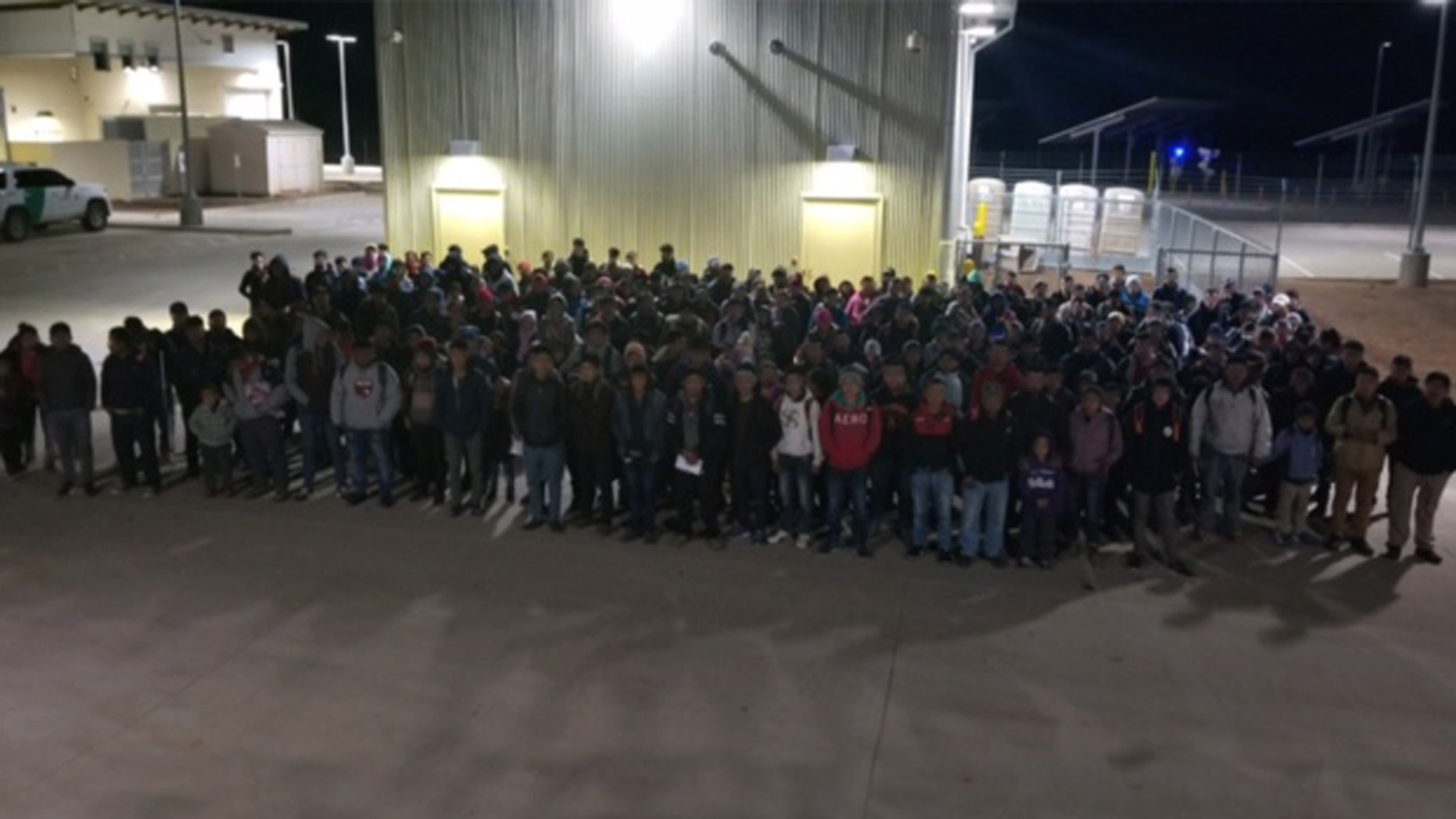 United States Border Patrol agents in New Mexico encountering a large group of immigrants.
