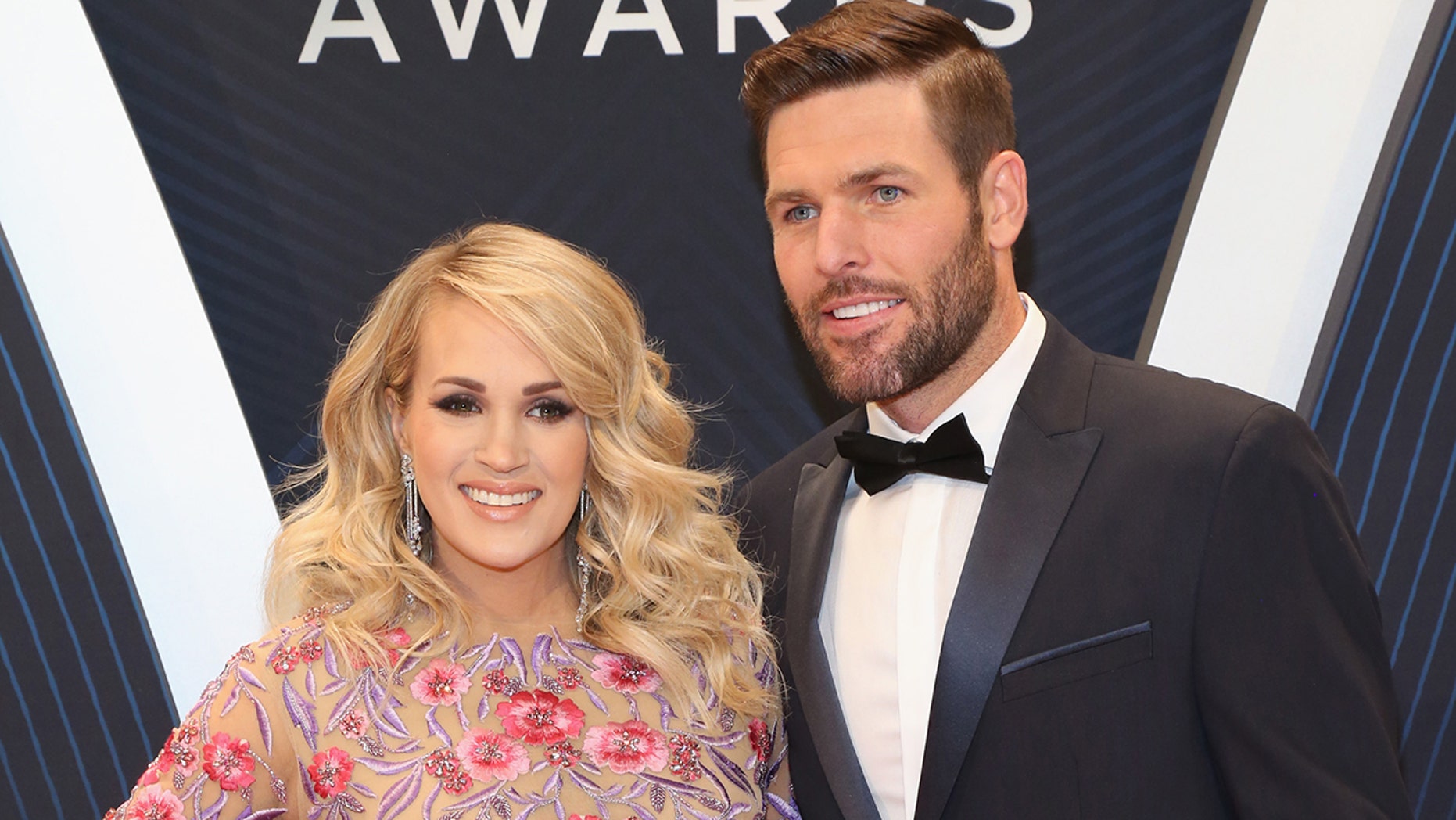 Pregnant Carrie Underwood and husband Mike Fisher adopt new puppy