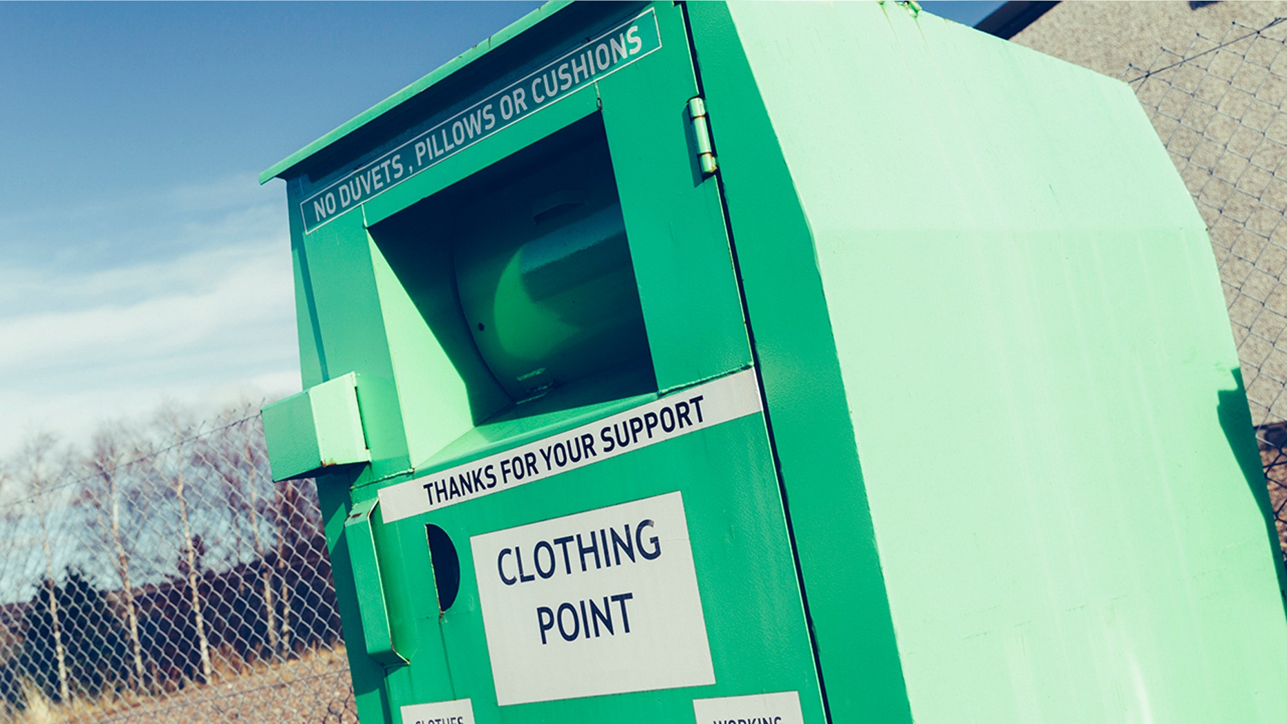 A woman found stuck partially inside a clothing donation bin was pronounced dead Tuesday, Toronto Police said.