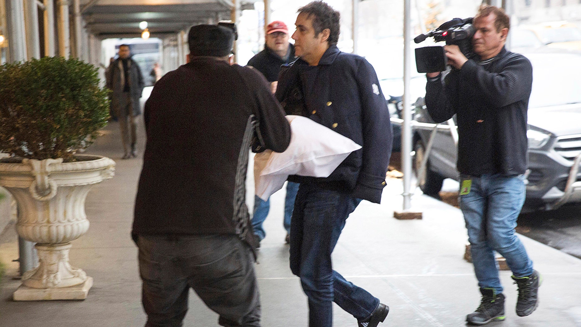 Cohen spotted with arm in sling, setting off speculation