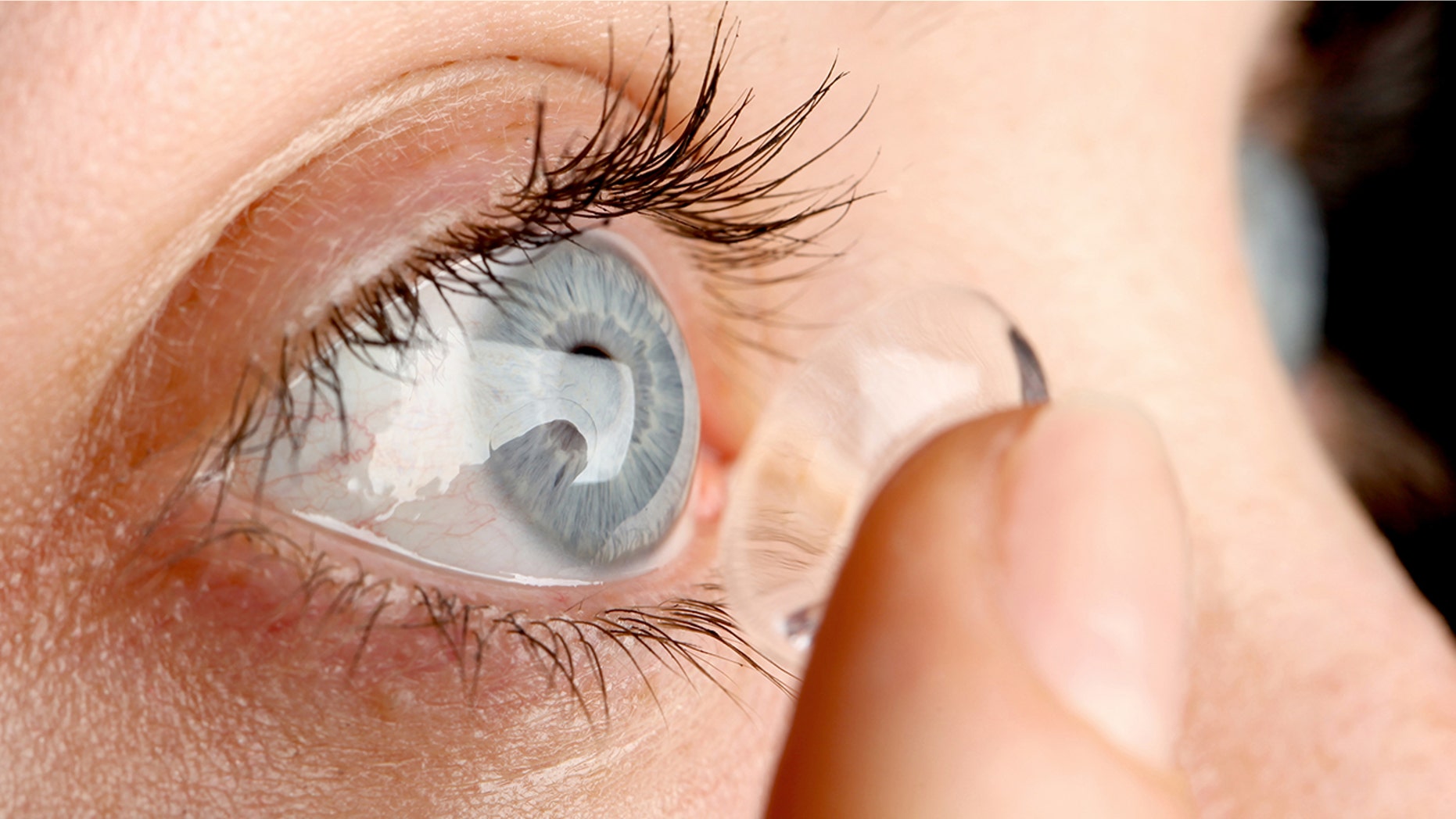 A bride is being slammed for considering asking her bridesmaids to wear colored contacts to change their eye color.