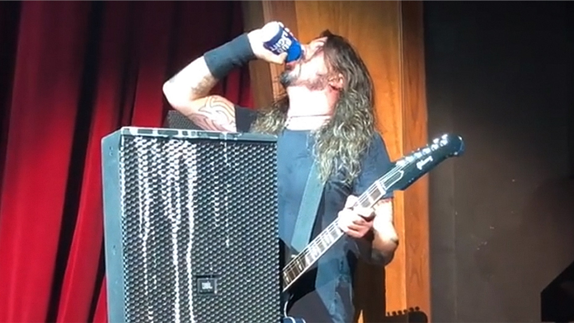 Foo Fighters' Dave Grohl chugs beer, falls off stage during recent