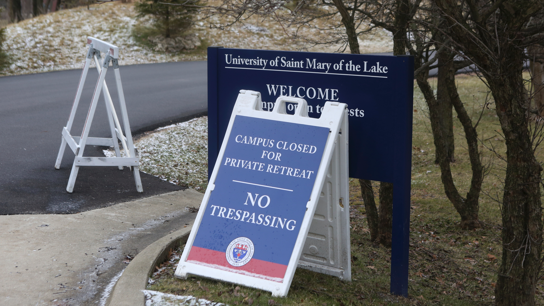 A sign outside the Mundelein Seminary asks the faithful to pray for U.S. based Roman Catholic bishops gathering there for a weeklong prayer retreat, Wednesday, Jan. 2, 2019, in Mundelein, Ill. The bishops are gathering to reflect on the church sexual abuse scandal ahead of a summit of the world's bishops next month at the Vatican aimed at forging a comprehensive response to the crisis. (AP Photo/Teresa Crawford)