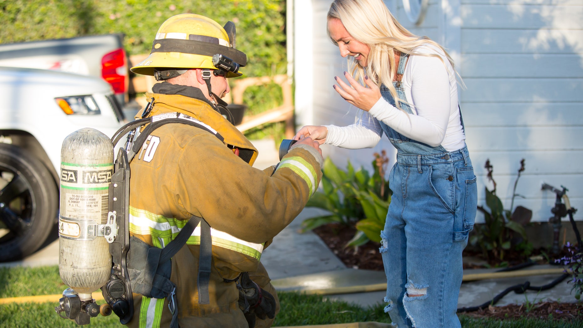 Fireman fiance Zach Steele, 30, proposes to girlfriend Maddison Ridgik, 30, after he faked a fire using smoke machines to create a surprise proposal at their home.