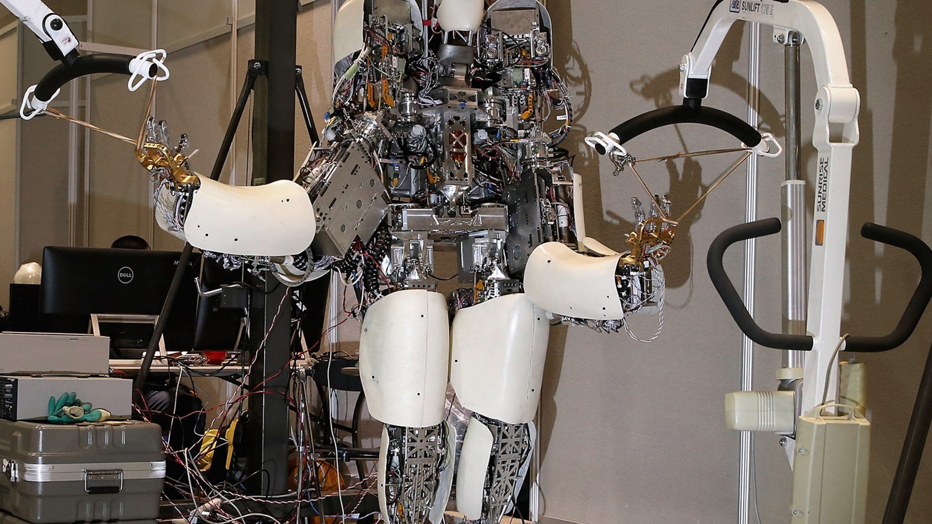 Team NEDO-Hydra's robot is held in place by racks inside the Robot Garage during the Defense Advanced Research Projects Agency (DARPA) Robotics Challenge, June 6, 2015 in Pomona, California.
