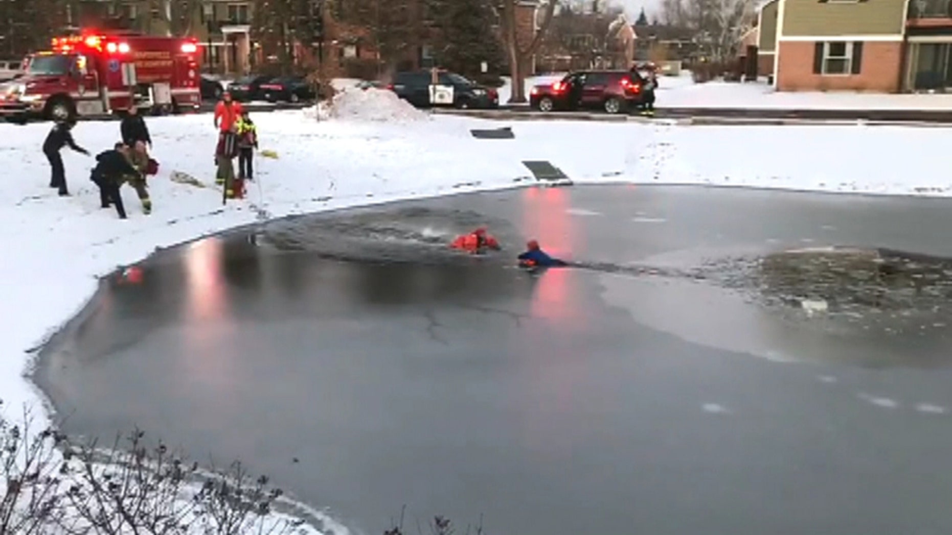 Dramatic rescue after boy, 11, falls through ice in Illinois pond seen in stunning video