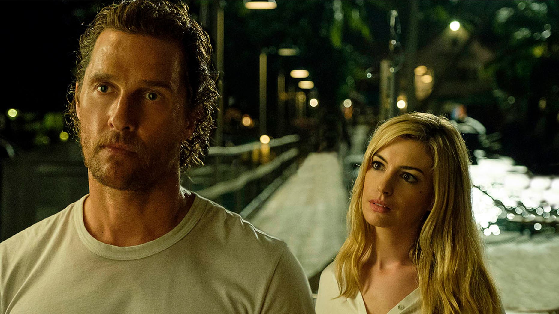 This picture published by Aviron Pictures shows Matthew McConaughey (left) and Anne Hathaway in one scene