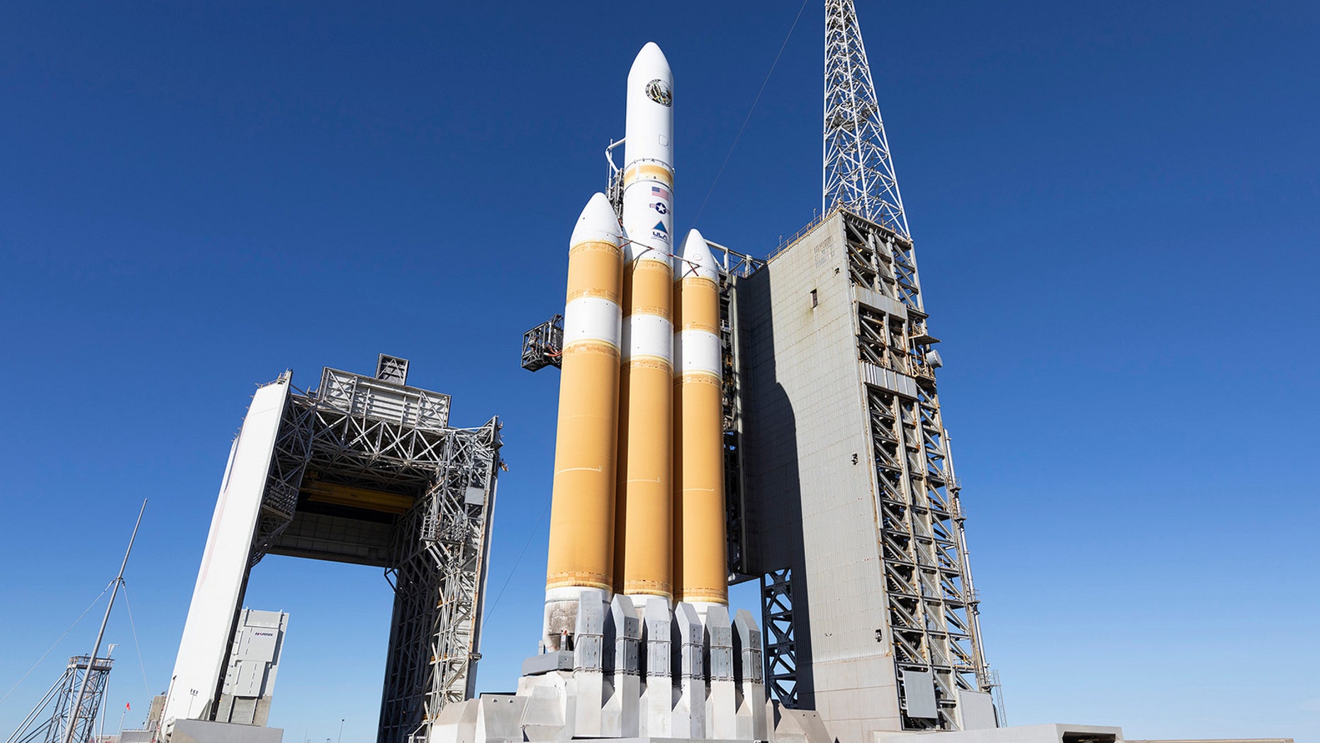 The mobile service tower rolls back from the United Launch Alliance (ULA) Delta IV Heavy rocket carrying NRO's NROL-71 mission in preparation for launch from Space Launch Complex 6 at Vandenberg Air Force Base in California. Liftoff is targeted for Jan. 19, 2018.