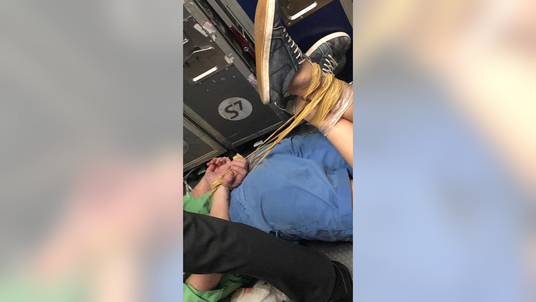 An unruly passenger on an S7 flight had to be hog-tied after getting drunk and behaving inappropriately.
