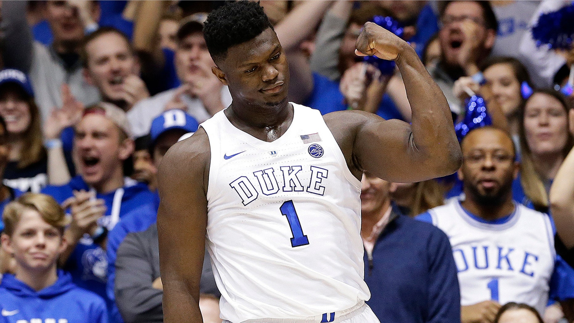 Duke's Zion Williamson (1) reacts following a basket against Virginia during the first half of an NCAA college basketball game in Durham, N.C., Saturday, Jan. 19, 2019. (AP Photo/Gerry Broome)