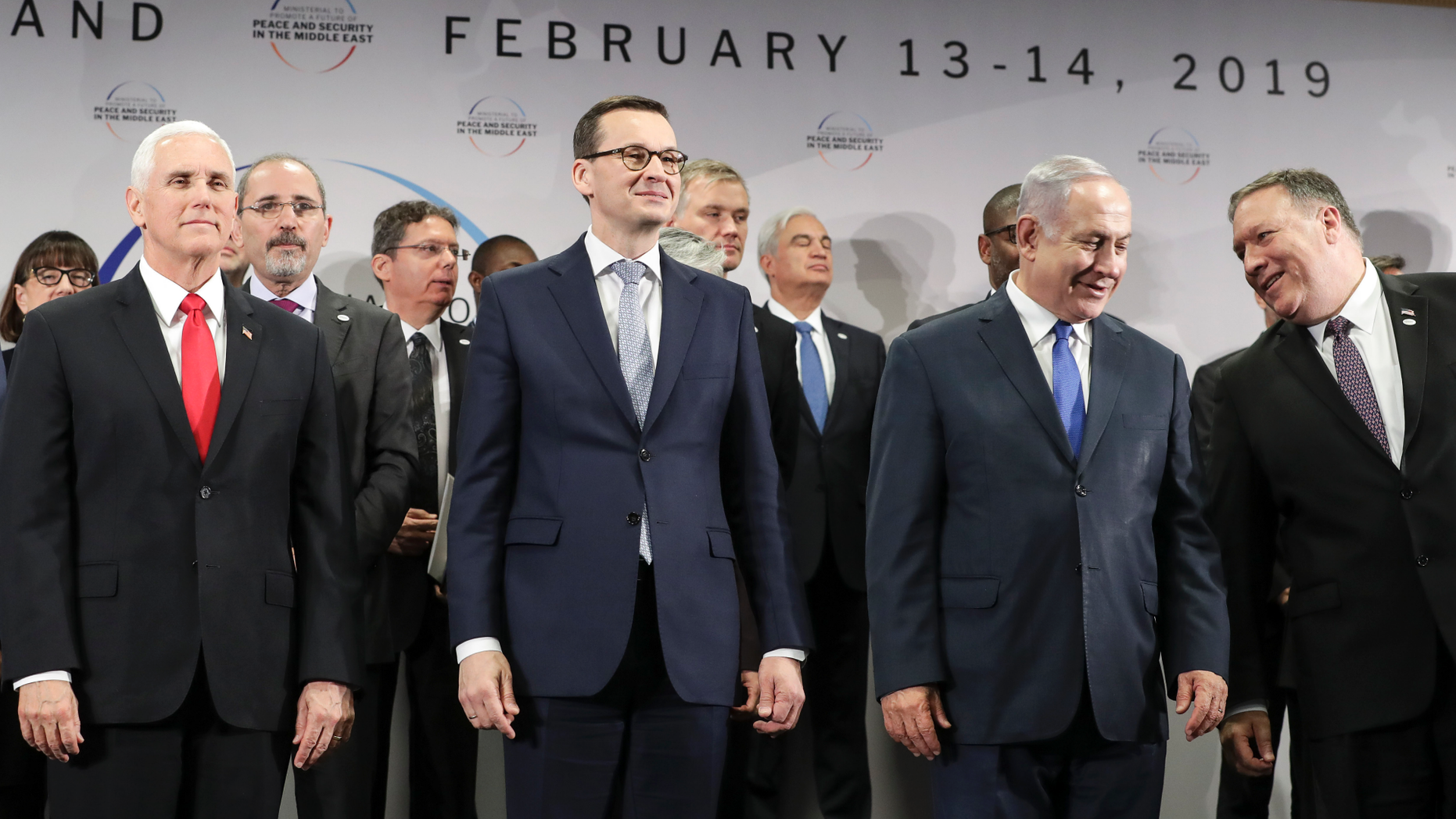 FILE - In this Thursday, Feb. 14, 2019 file photo, United States Vice President Mike Pence, Prime Minister of Poland Mateusz Morawiecki, Israeli Prime Minister Benjamin Netanyahu and United State Secretary of State Mike Pompeo, from left, stand on a podium at a conference on Peace and Security in the Middle East in Warsaw, Poland. A two-day security conference in Warsaw was supposed to be a crowning achievement for Israeli Prime Minister Benjamin Netanyahu, stamping a seal on his long-held goal of pushing his behind-the-scenes ties with Arab leaders into the open. Instead, the publicity-seeking Israeli leader made one embarrassing misstep after another, distracting attention from his main mission and sending his aides into a nonstop cycle of damage control. (AP Photo/Michael Sohn, File)