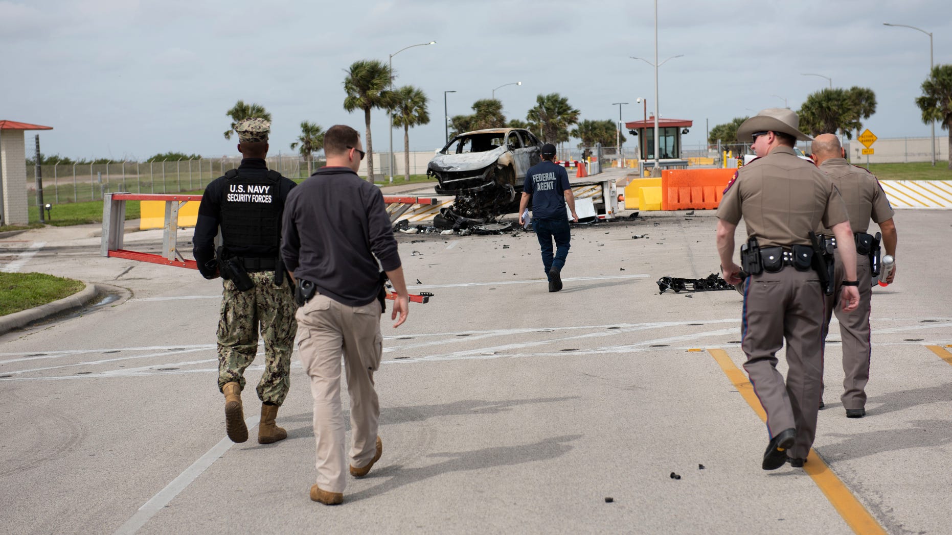 A man who crashed his car through the gate of a Texas naval base early Thursday and tried to attack security personnel was shot and killed.