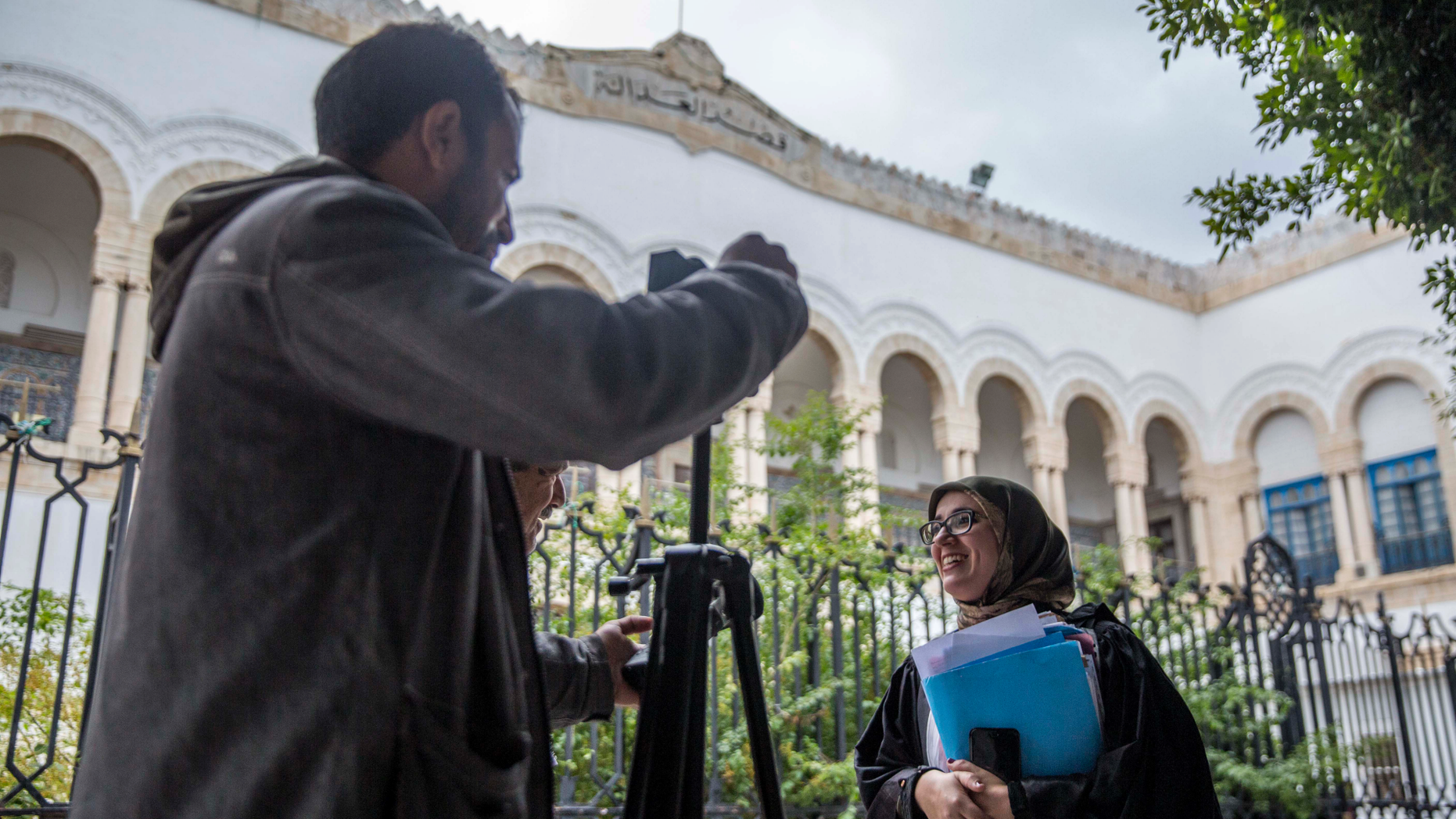 Imen Triqui, one of the defense lawyers talks to the Associated Press outside the Hall of Justice in Tunis, Friday, Feb.8, 2019. More than 40 people have been summoned to face trial over Tunisia's deadliest attack in a Mediterranean resort in 2015 and the verdict in expected Friday Feb.8, 2019, more than 3-1/2 years after the attack on the Imperial Hotel in the beach resort of Sousse left 38 people dead, mostly British tourists (AP Photo/Hassene Dridi)