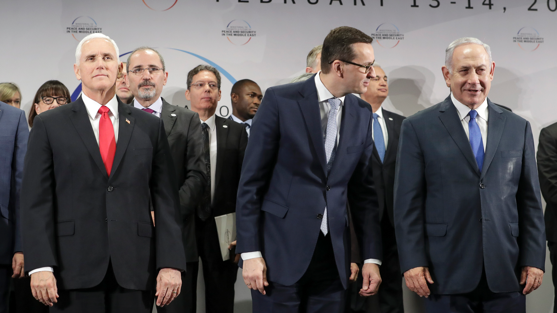 United States Vice President Mike Pence, Prime Minister of Poland Mateusz Morawiecki and Israeli Prime Minister Benjamin Netanyahu, from left, stand on a podium at a conference on Peace and Security in the Middle East in Warsaw, Poland, Thursday, Feb. 14, 2019. The Polish capital is host for a two-day international conference, co-organized by Poland and the United States. (AP Photo/Michael Sohn)
