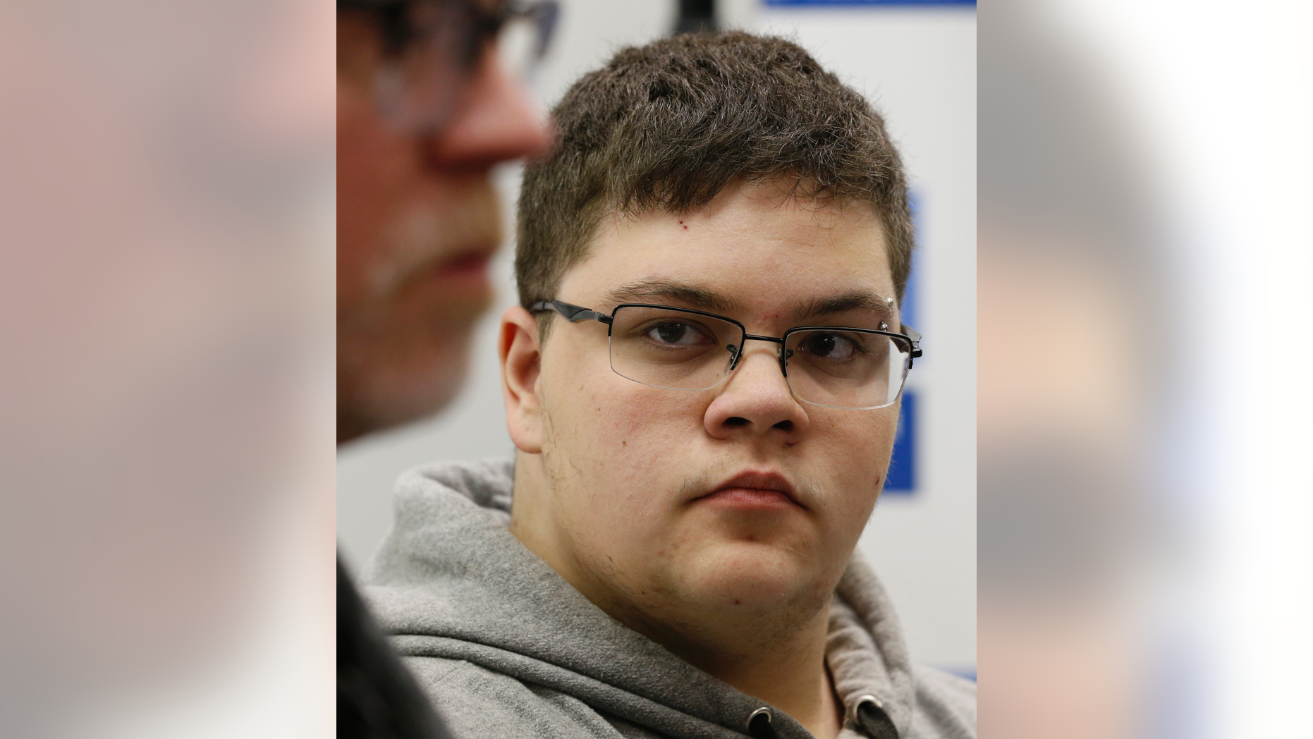 FILE - In this March 6, 2017, file photo, Gloucester County High School senior Gavin Grimm, a transgender student, listens to a speaker during a news conference in Richmond, Va. Grimm is continuing to sue the Gloucester County School Board in Virginia over a policy that banned him from using the boys' bathrooms. He's now trying to amend the suit to include the matter of his unchanged transcripts. (AP Photo/Steve Helber, File)