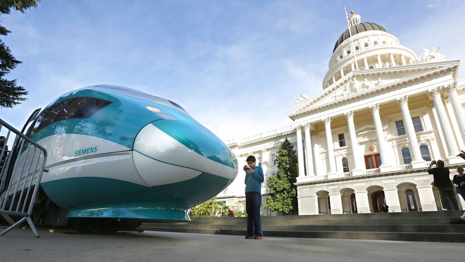 FILE - In this Feb. 26, 2015, file photo, a full-scale mock-up of a high-speed train is displayed at the Capitol in Sacramento, Calif. (Associated Press)