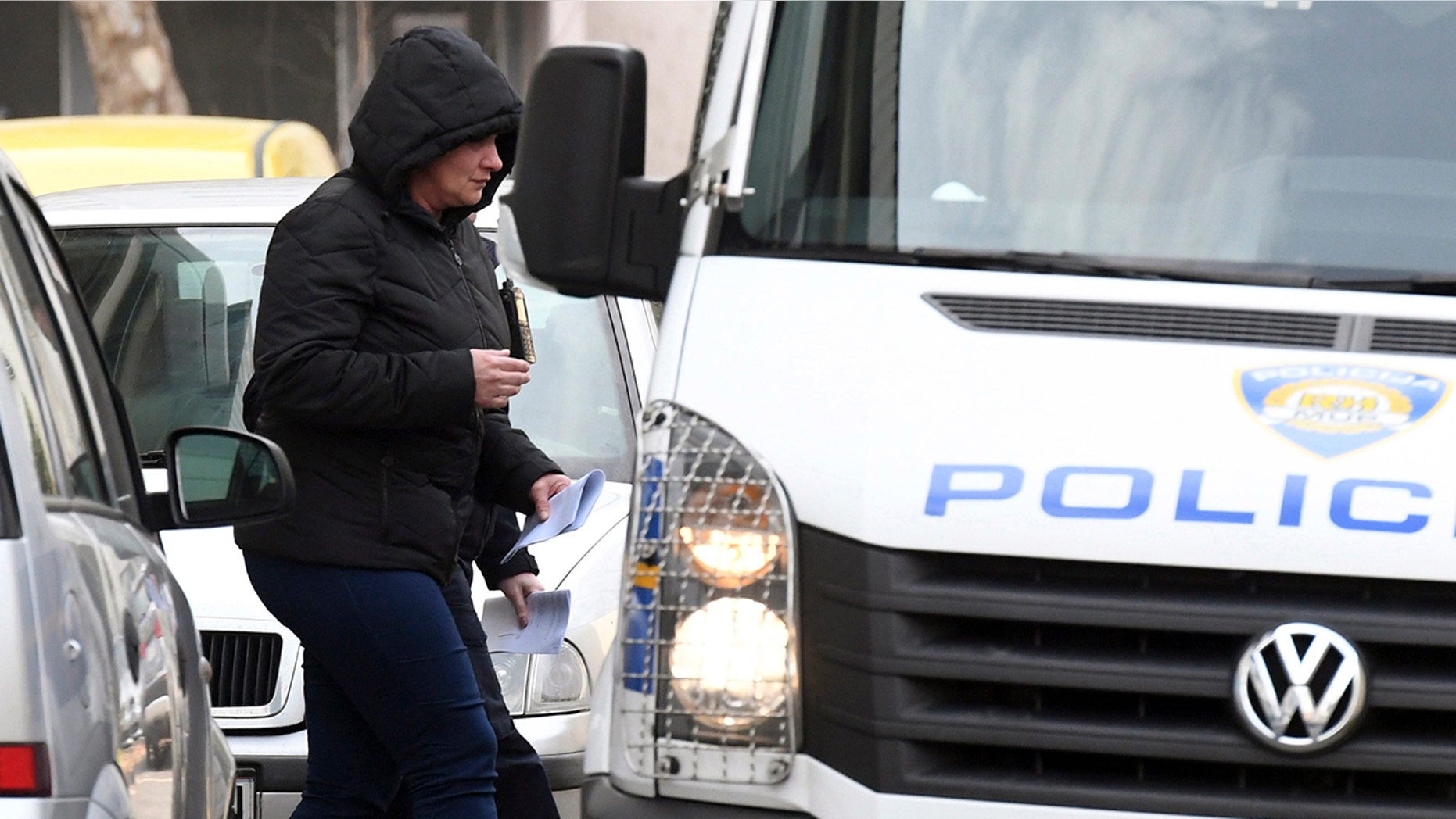 Smiljana Srnec who is suspected of killing her sister Jasmina Dominic is escorted to a police vehicle from a court in Varazdin, Croatia, Wednesday, Feb. 20, 2019. A Croatian court on Wednesday ordered one month’s detention for Srnec of killing her younger sister, whose body was found in a freezer more than 18 years after she went missing. (AP Photo)