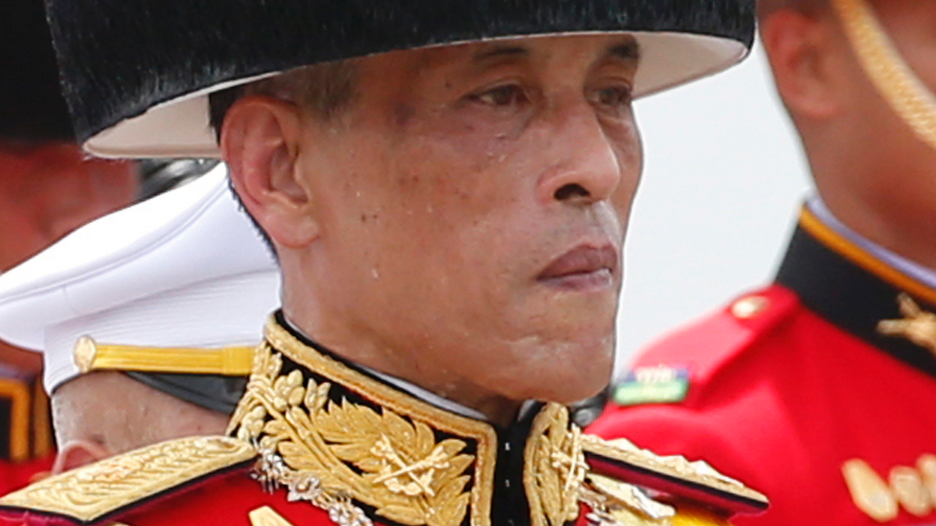 FILE - In this Oct. 26, 2017, file photo, Thailand's King Maha Vajiralongkorn walks in a funeral procession of his father the late King Bhumibol Adulyadej in Bangkok, Thailand. Late Friday, Feb. 8, 2019, King Vajiralongkorn issued a decree stating that no member of the royal family should be involved in politics, quashing a bid by his older sister to run for prime minister in next month's elections. (AP Photo/Sakchai Lalit, File)