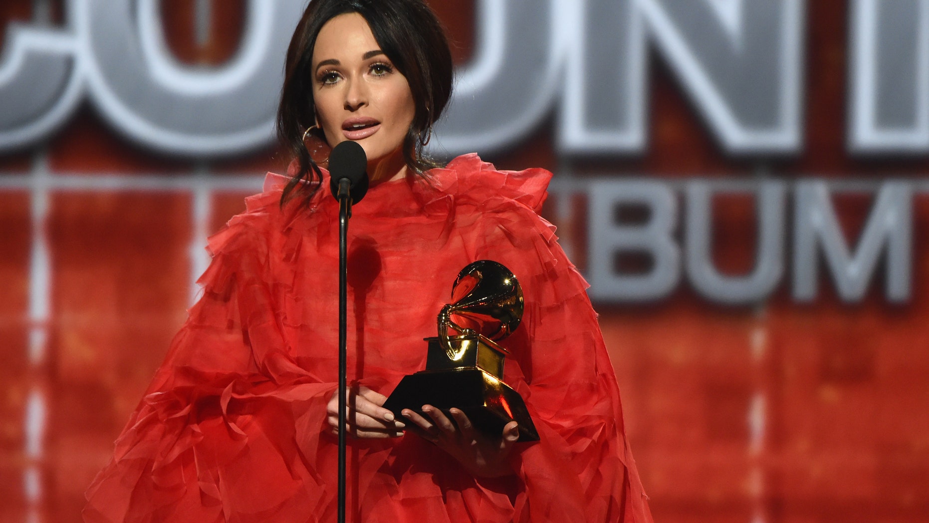 Kacey Musgraves, who took home four Grammys on Sunday including Album of the Year, spoke to reporters backstage on if she thinks her Grammy wins will help get her music on the radio.