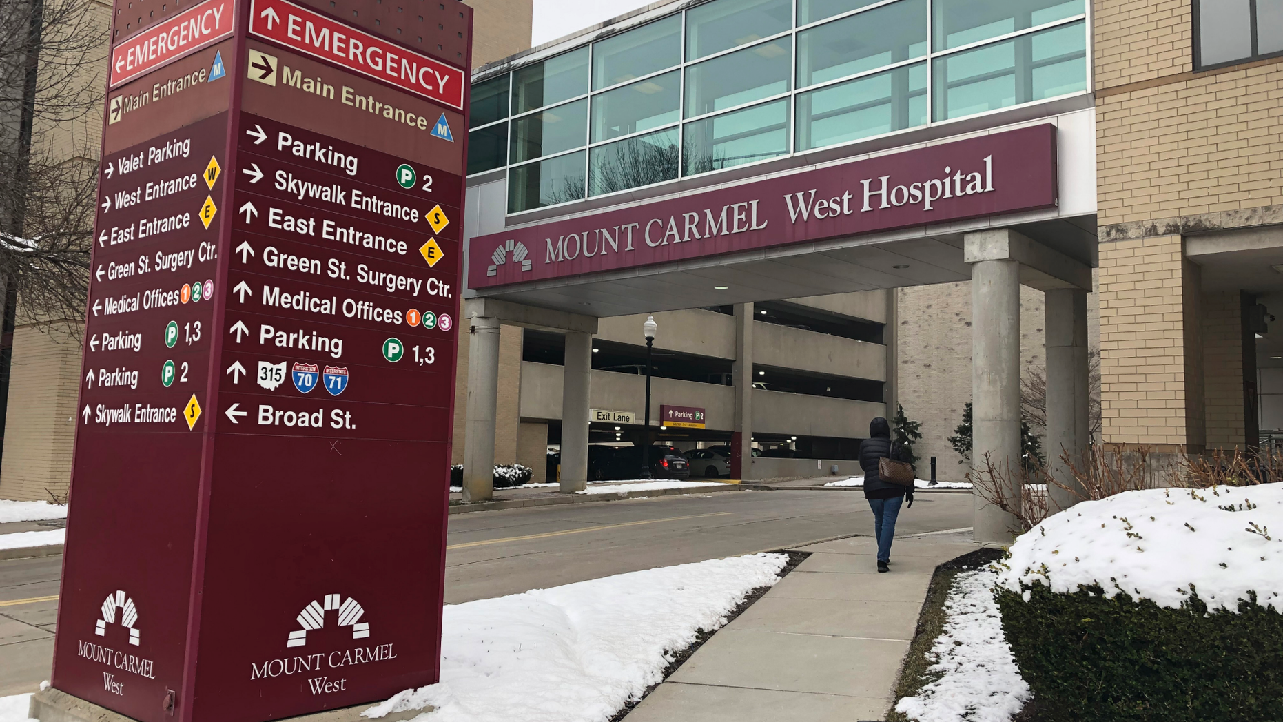 FILE - In this Jan. 15, 2019 file photo, the main entrance to Mount Carmel West Hospital is shown in Columbus, Ohio. The Ohio hospital system investigating a doctor accused of ordering painkiller overdoses for dozens of patients says five who died may have received excessive doses when there still was a chance to improve their conditions with treatment. The Columbus-area Mount Carmel Health System said Friday, Feb. 22 it's notifying those patients' families. (AP Photo/Andrew Welsh Huggins, File)