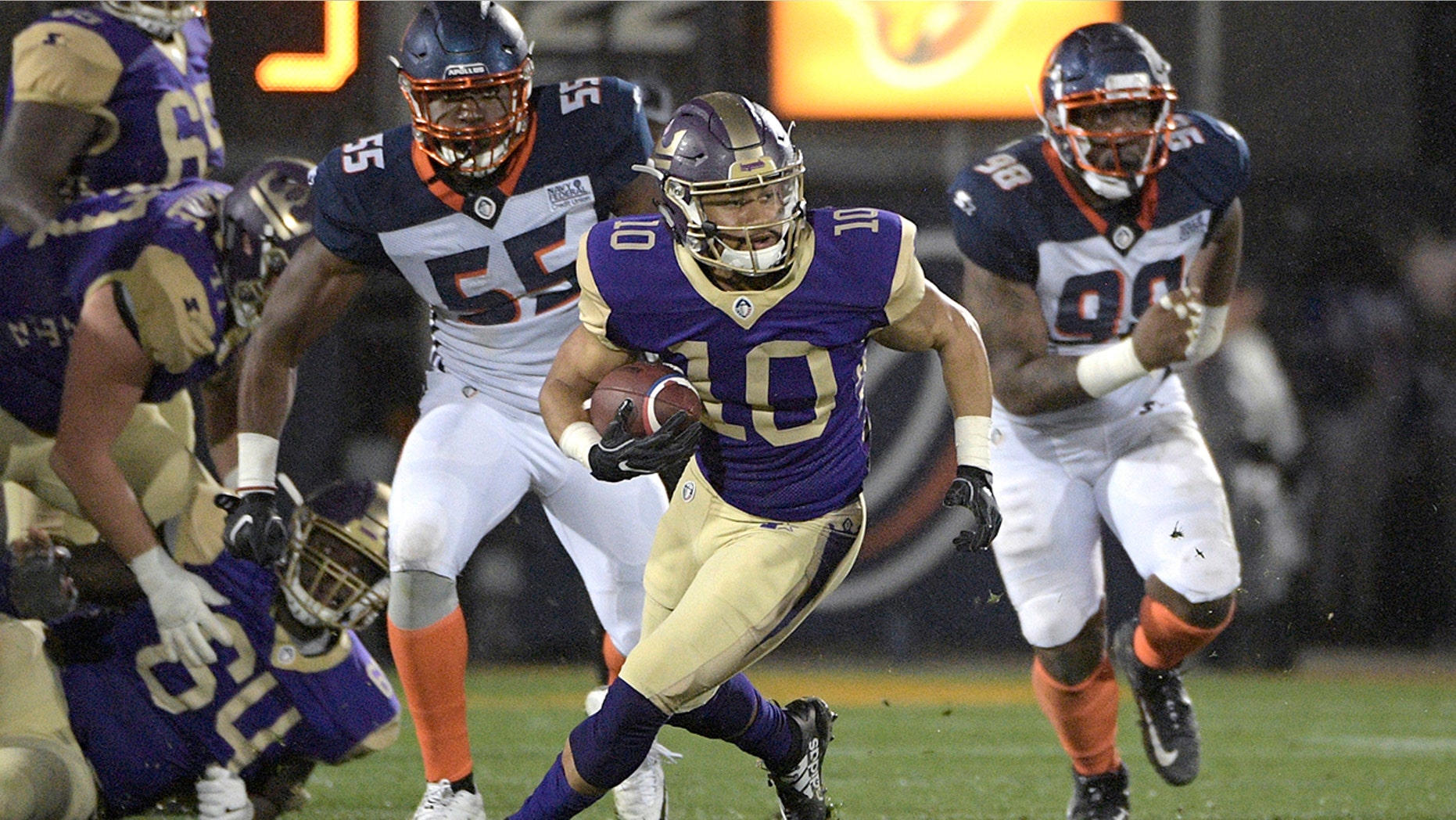 Atlanta Legends receiver Justin Thomas (10) runs with a reception in front of Orlando Apollos linebacker Andrew Ankrah (55) and defensive end Anthony Moten Jr. (98) during the second half of an Alliance of American Football game Saturday, Feb. 9, 2019, in Orlando, Fla.