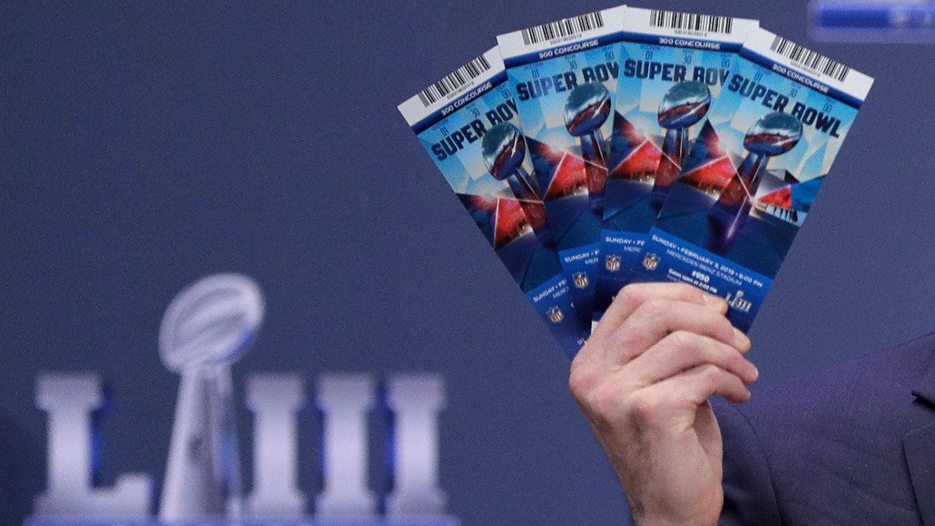 Ex-Microsoft exec pleads guilty to theft, resale of nearly $1M in Super Bowl tickets, authorities say