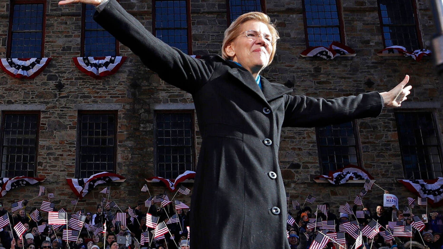 Sen. Elizabeth Warren, D-Mass., acknowledges cheers as she takes the stage during an event to formally launch her presidential campaign.