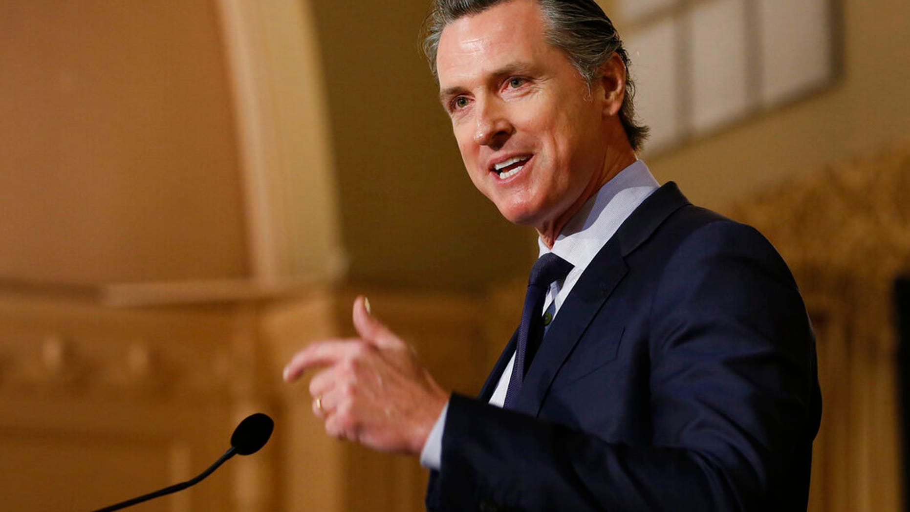 FILE: Gov. Gavin Newsom speaks at the California Legislative Black Caucus Martin Luther King Jr., Breakfast, in Sacramento, Calif.