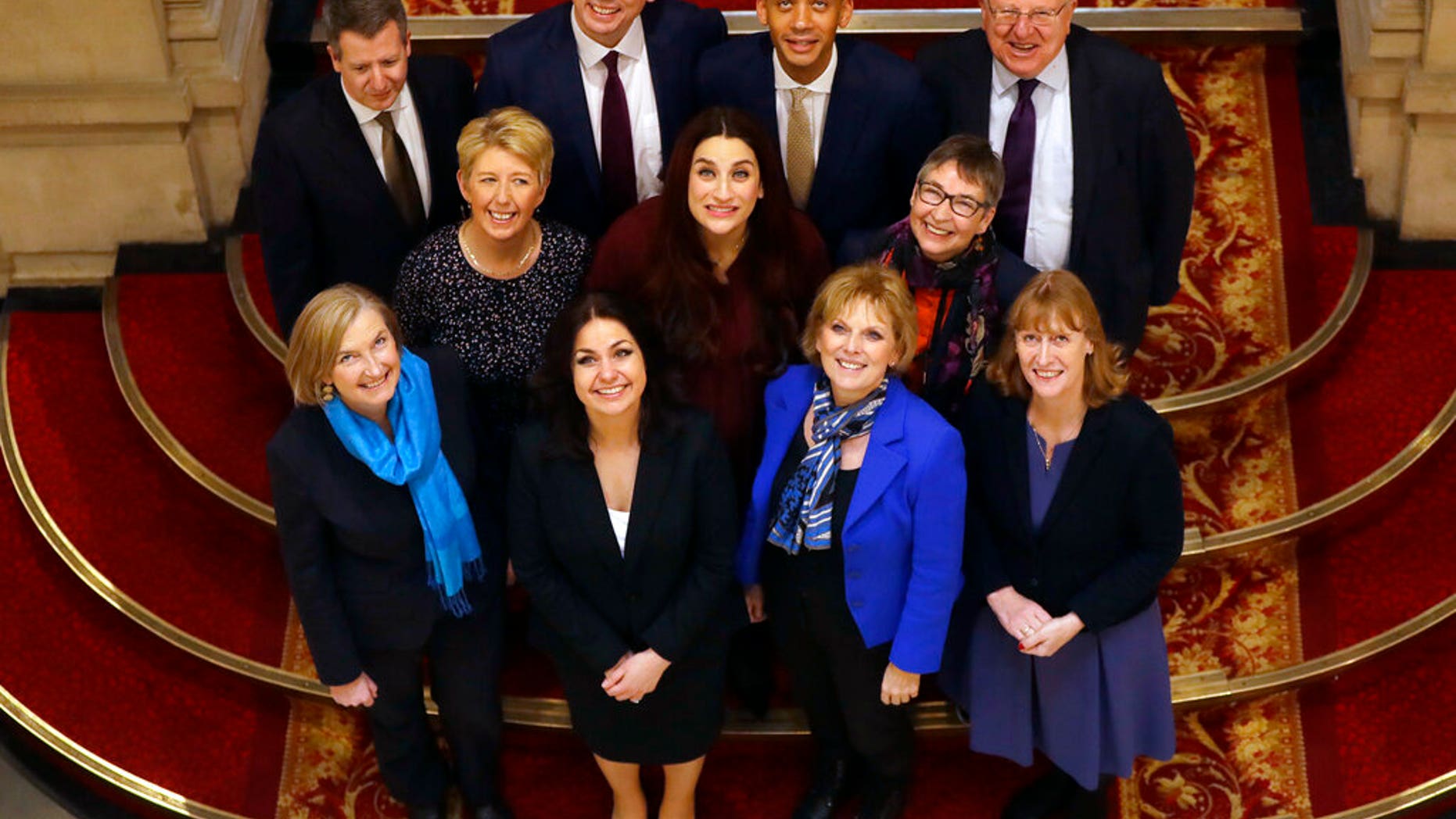 Eleven British politicians who have joined new political party 'The Independent Group' pose for a photograph after a press conference in Westminster in London, Wednesday, Feb. 20, 2019.