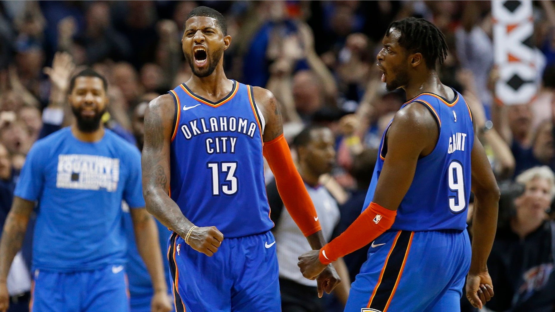 Oklahoma City Thunder forwards Paul George (13) and Jerami Grant (9) celebrate after George hit a shot with less than a second left in the second overtime of an NBA basketball game against the Utah Jazz in Oklahoma City, Friday, Feb. 22, 2019. The Thunder won 148-147.