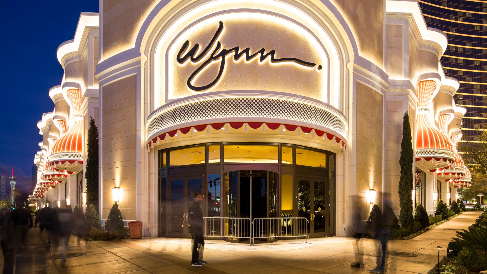 FILE - In this Jan. 27, 2018, file photo, people pass by Wynn Las Vegas on the Vegas Strip. A year after Steve Wynn, the founder of Wynn Resorts, was accused of sexual misconduct, Nevada gambling regulators on Tuesday reportedly slapped a multi-million dollar fine against his former company for not looking into the allegations.