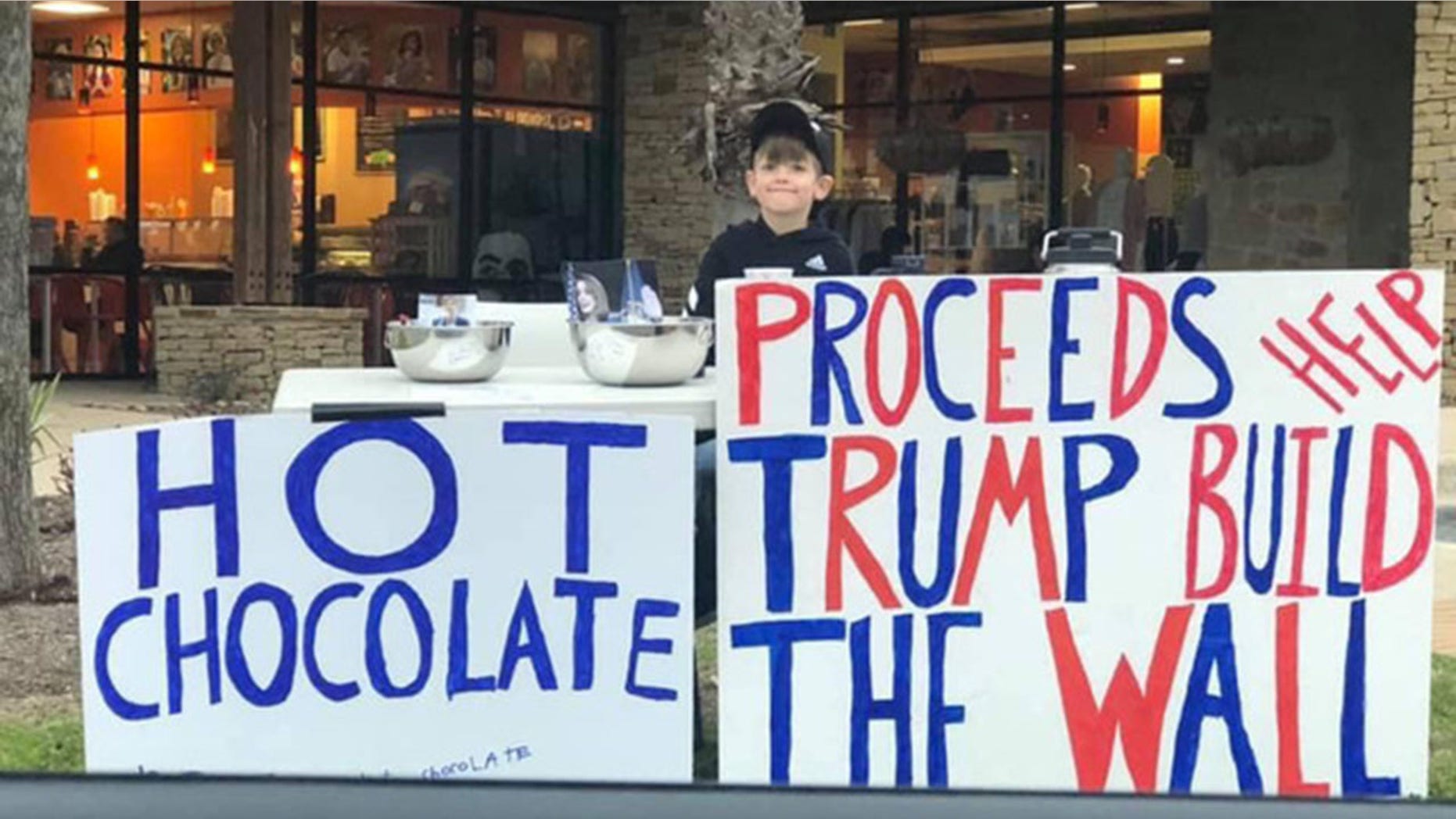 A seven-year-old Texas boy was called "Little Hitler" for setting up a hot chocolate stand to raise money for Trump's border wall, according to his parents