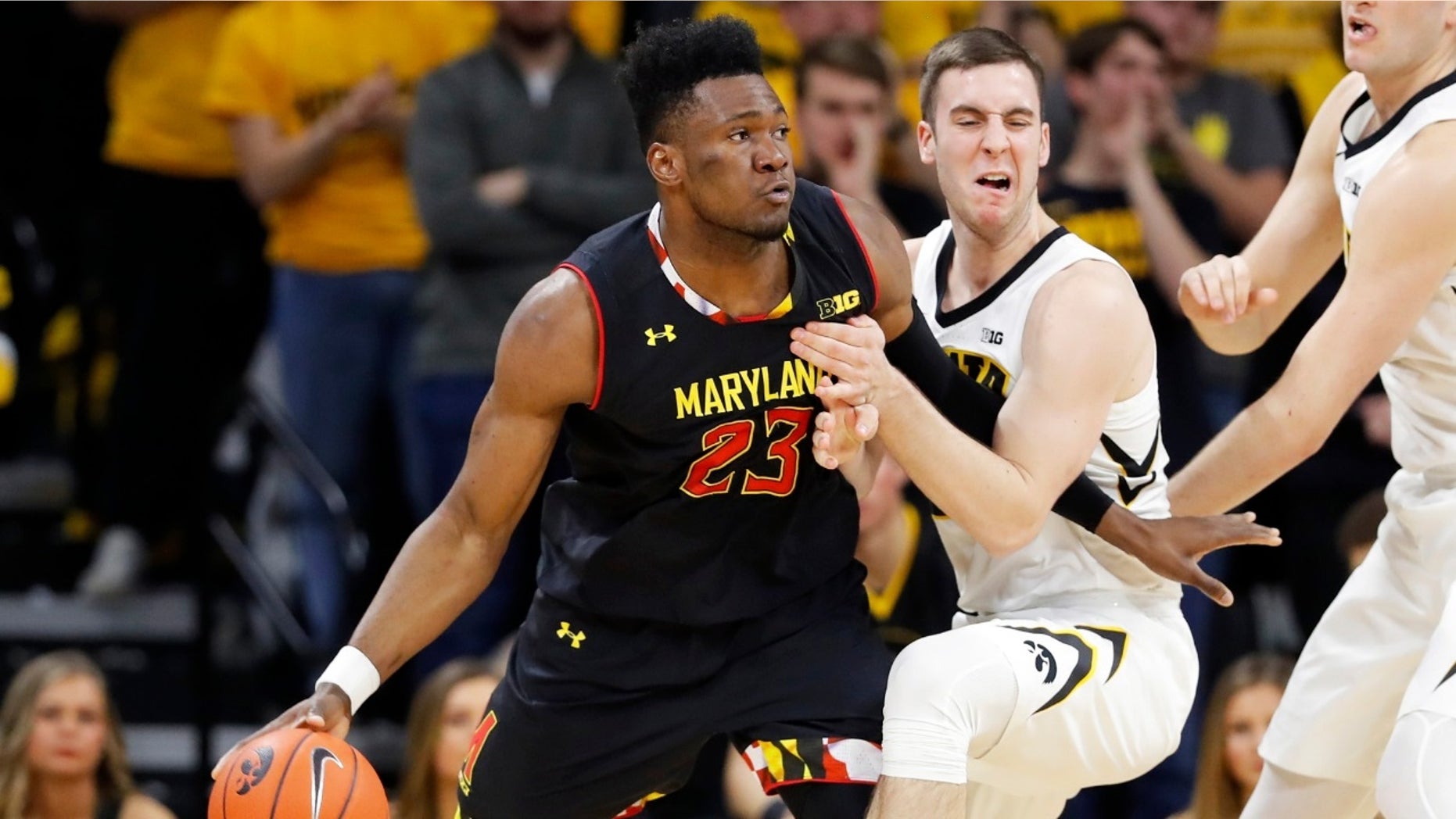Maryland forward Bruno Fernando (23) drives past Iowa guard Connor McCaffery during the second half of an NCAA college basketball game Tuesday, Feb. 19, 2019, in Iowa City, Iowa.