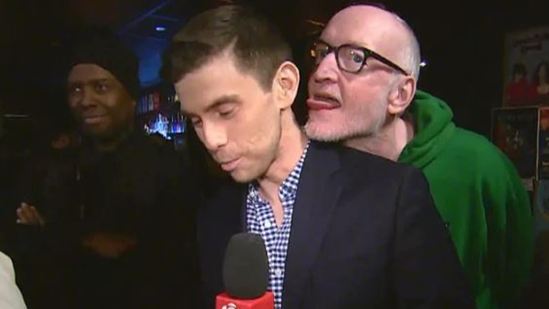 A Canadian actor and comedian was seen in a video appearing to lick a reporter during a live hit.