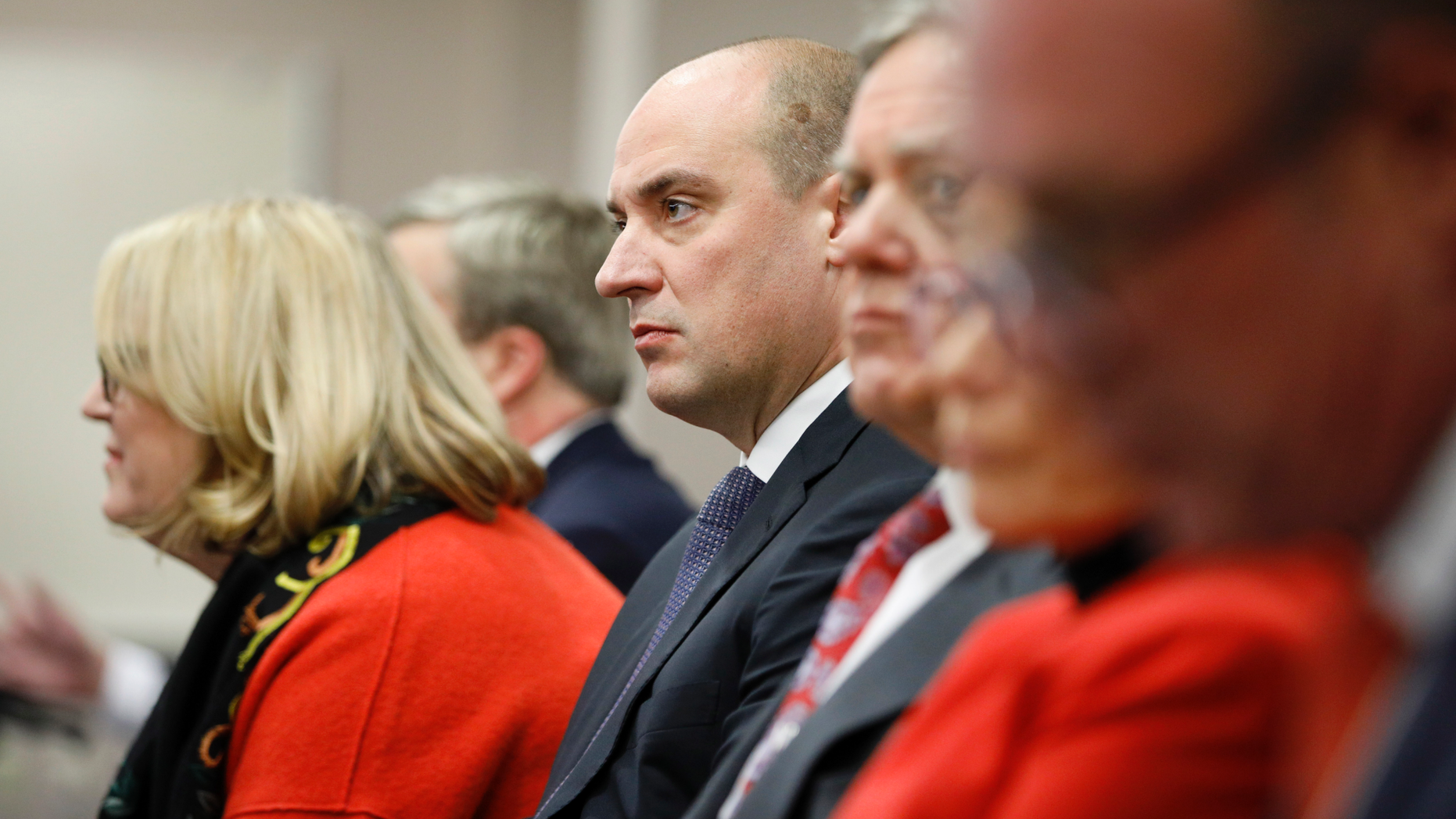 Matt Maddox, center, CEO of Wynn Resorts Ltd., attends a meeting of the Nevada Gaming Commission, Tuesday, Feb. 26, 2019, in Las Vegas. (AP Photo/John Locher)
