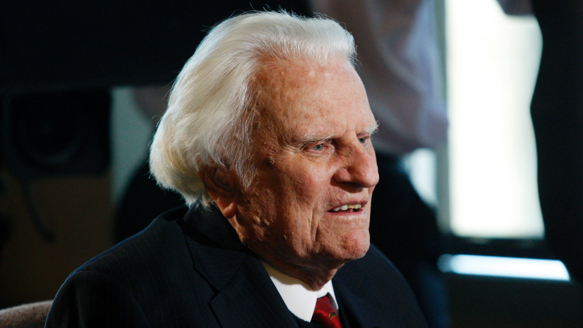 FILE - In this Dec. 20, 2010 file photo, Evangelist Billy Graham is interviewed at the Billy Graham Evangelistic Association headquarters in Charlotte, N.C. The Billy Graham Library in North Carolina says it has seen a surge in visitors in the year since its namesake’s death. Citing a blog post on the library’s website, WLOS-TV reports that 214,000 people visited the Charlotte complex in 2018, up from 144,000 in 2017. According to the post, visitors came from 55 countries. Graham died Feb. 21, 2018, at age 99. (AP Photo/Nell Redmond, File)