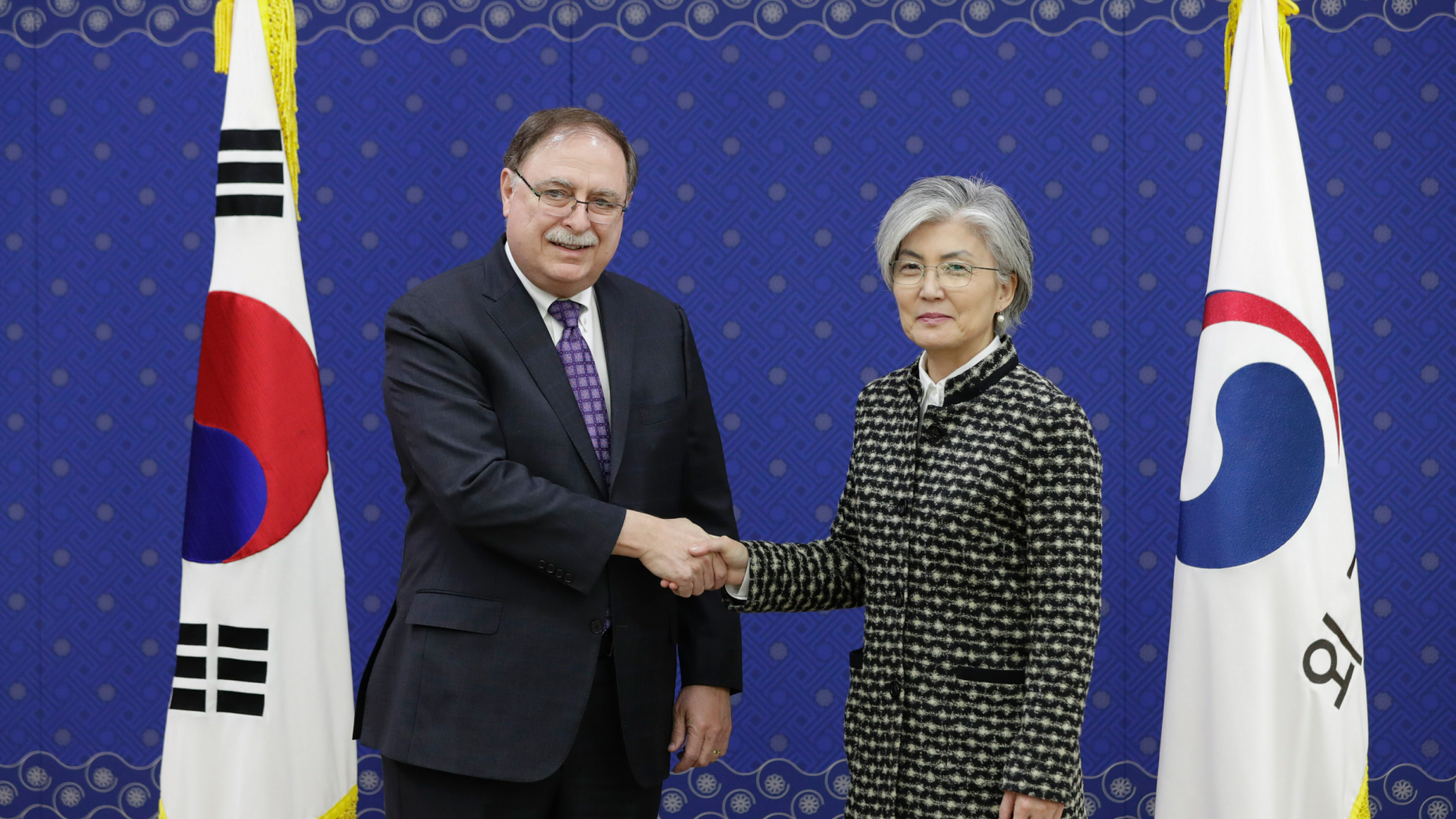 South Korean Foreign Minister Kang Kyung-wha, right, and Timothy Betts, acting Deputy Assistant Secretary and Senior Advisor for Security Negotiations and Agreements in the U.S. Department of State, shake hands for the media before their meeting at Foreign Ministry in Seoul, South Korea, Sunday, Feb. 10, 2019. (AP Photo/Lee Jin-man, Pool)