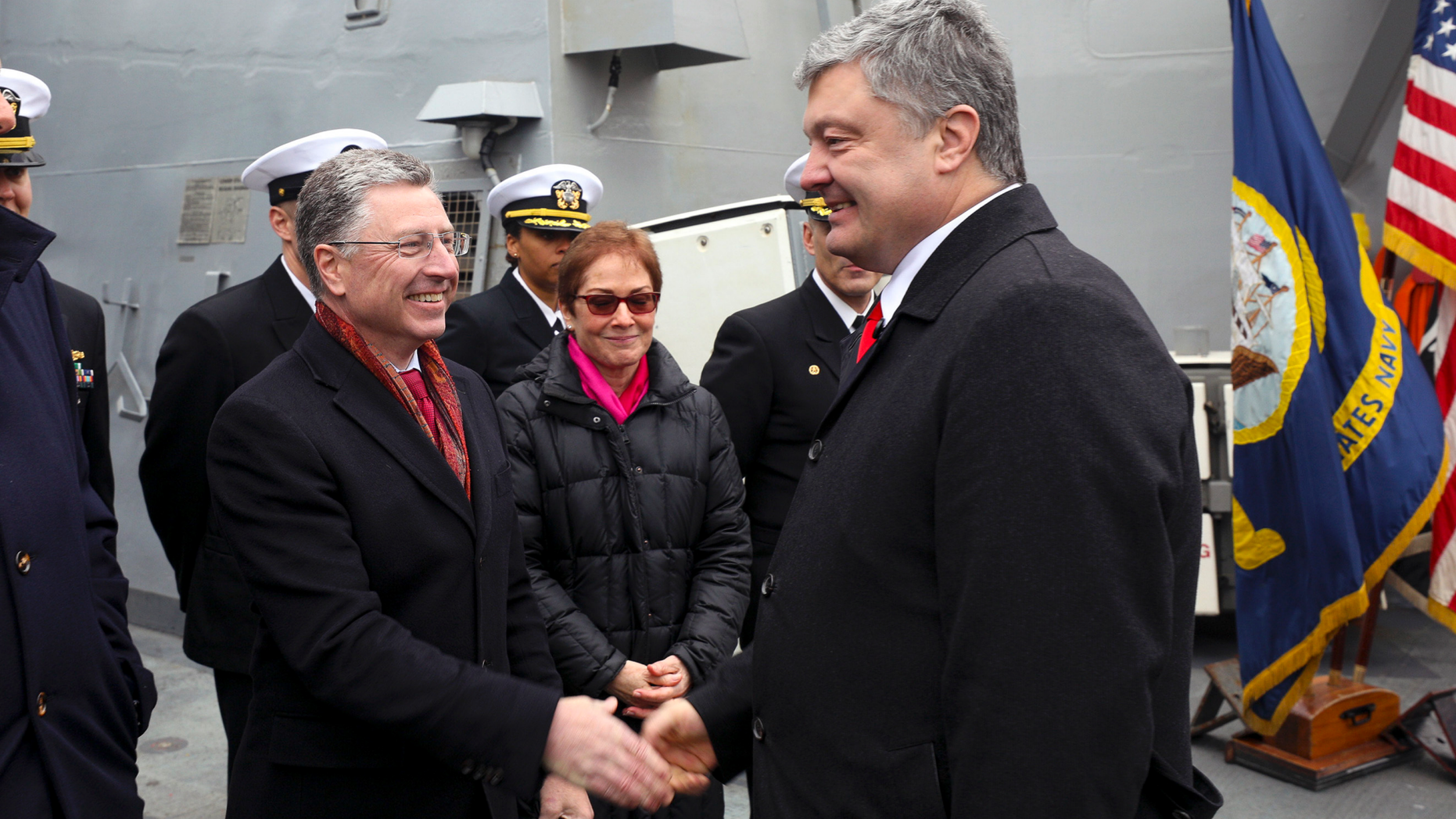 Ukraine's President Petro Poroshenko, right, shakes hands with US Special Representative for Ukraine Kurt Volker as he visited the US Navy destroyer Donald Cook in Odessa, Ukraine, Tuesday, Feb. 26, 2019. (Mikhail Palinchak, Presidential Press Service Pool Photo via AP)