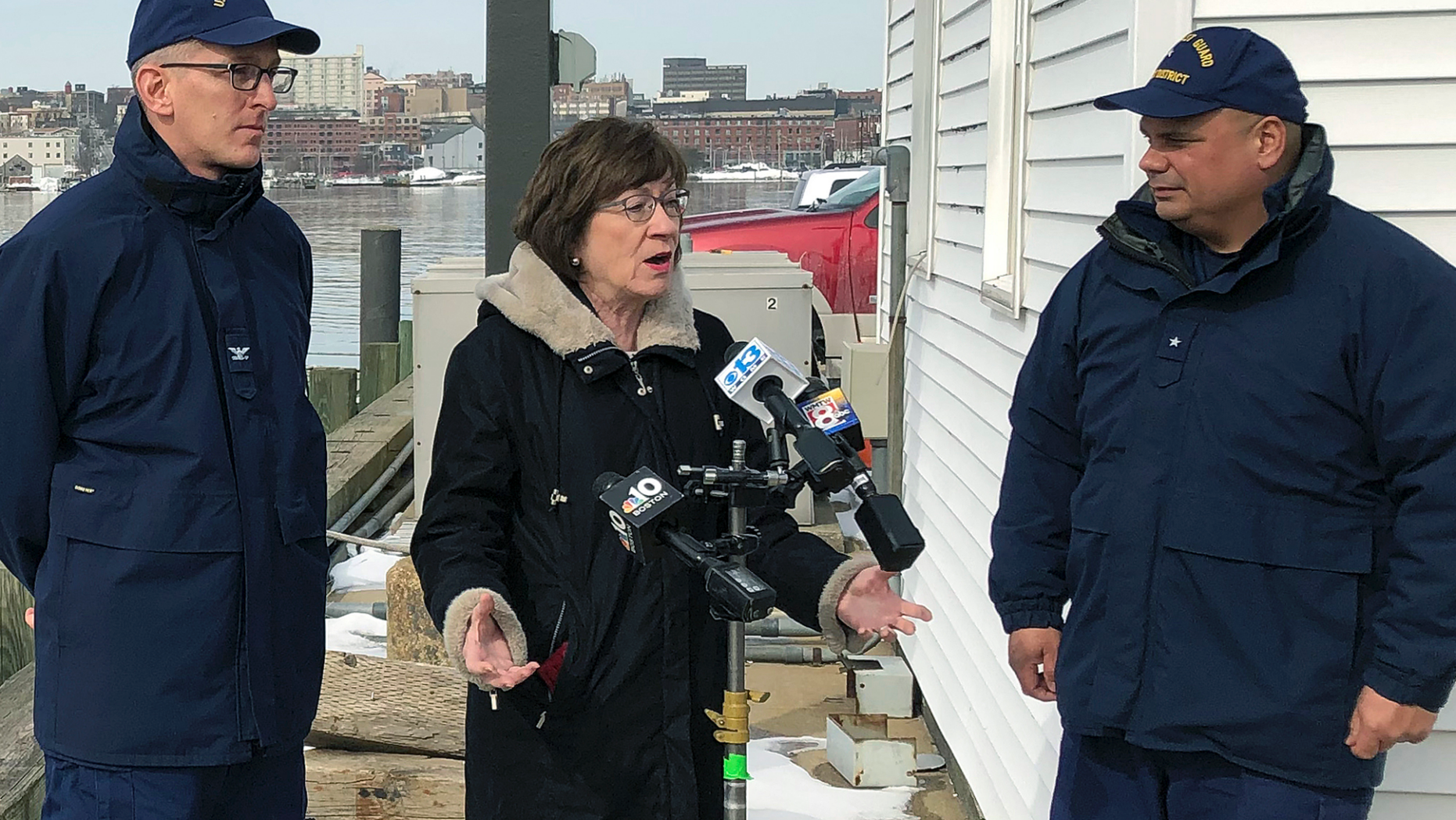 US Senator Susan Collins, R-Maine, is accompanied by Coast Guard Captain Brian LeFebvre, left, and Rear-Admiral Andrew Tiongson, right, while she addresses reporters after the ribbon cutting at a US Coast Guard Regional Command Center Wednesday, February 20, 2019, South Portland, Maine. Collins said she would vote for a congressional resolution disapproving of President Donald Trump's emergency declaration to build a wall on the southern border. She is the first Republican senator to publicly express her support for such a resolution. (AP Photo / David Sharp)