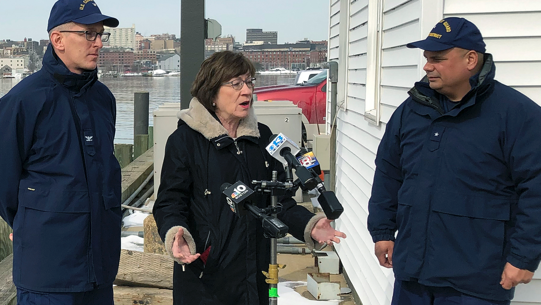 U.S. Sen. Susan Collins, R-Maine, is flanked by Coast Guard Capt. Brian LeFebvre, left, and Rear Adm. Andrew Tiongson, right, as she addresses reporters after the ribbon-cutting at a U.S. Coast Guard regional command center Wednesday, Feb. 20, 2019, in South Portland, Maine. Collins said that she would vote for a congressional resolution disapproving of President Donald Trump's emergency declaration to build a wall on the southern border. She is the first Republican senator to publicly express support for such a resolution. (AP Photo/David Sharp)