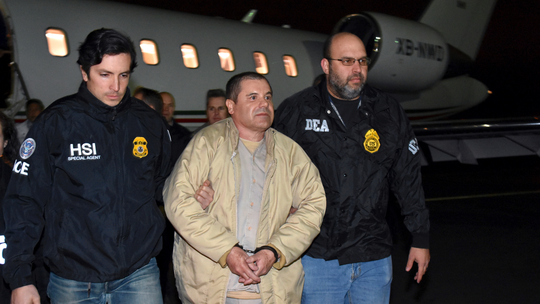 FILE - In this Jan. 19, 2017 file photo provided U.S. law enforcement, authorities escort Joaquin
