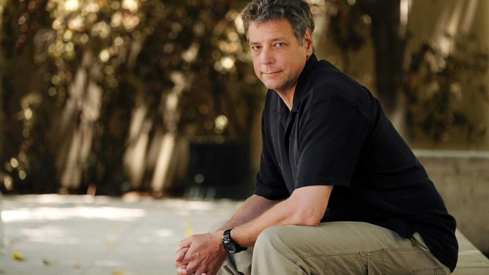 FILE - In this June 20, 2018, file photo, Michael Scott Moore, author of "The Desert and the Sea: 977 Days Captive on the Somali Pirate Coast," poses for a portrait at Los Angeles Public Library in Los Angeles. Abdi Yusuf Hassan, a U.S. citizen who has been charged with kidnapping and other counts for his alleged role in the abduction of Moore. He was held for nearly three years before his family paid a ransom for his release. (AP Photo/Chris Pizzello, File)