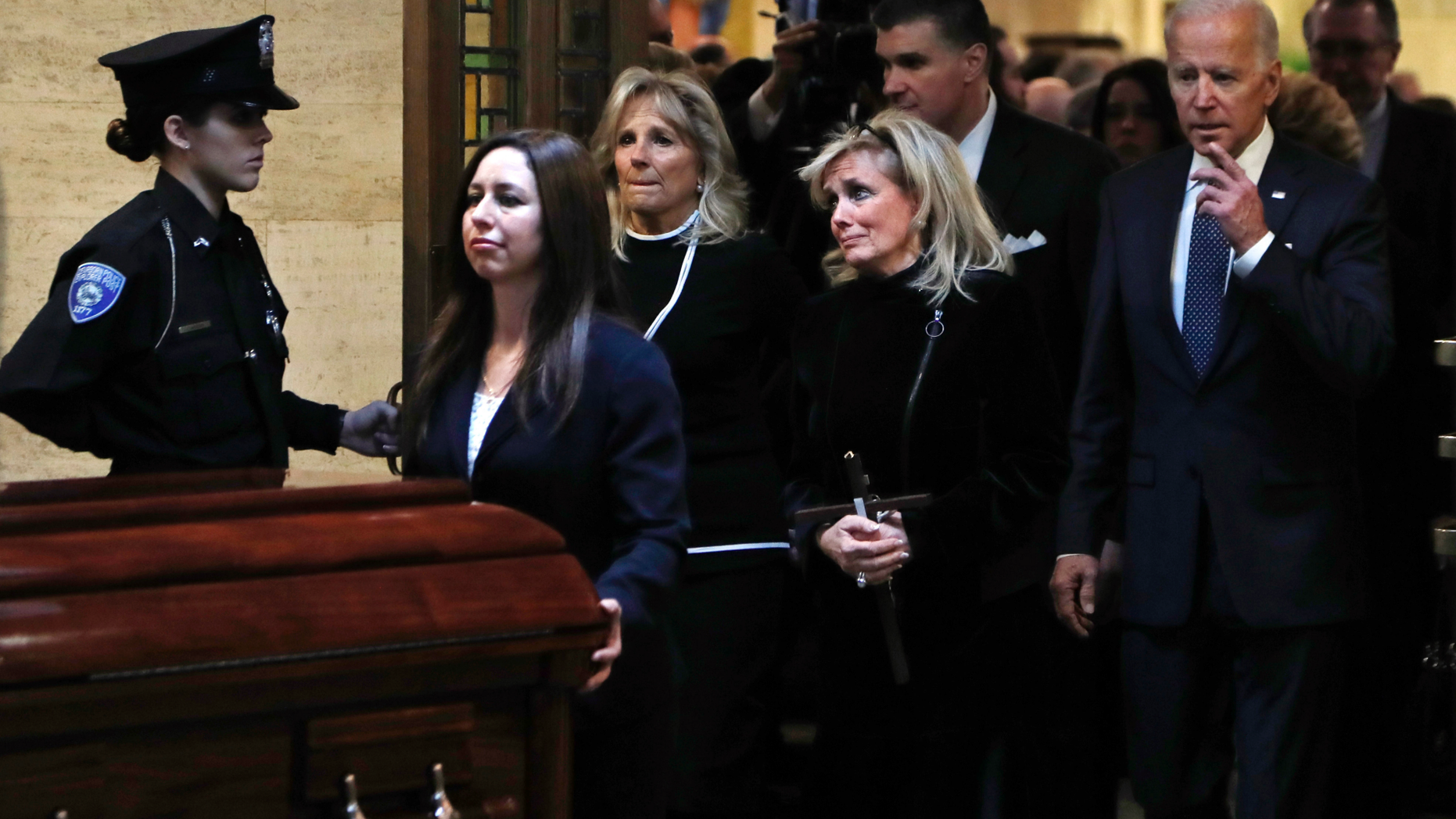 Congresswoman Debbie Dingell, center, follows the casket procession out of the Church of the Divine Child after a funeral mass for her husband John Dingell, Tuesday, Feb. 12, 2019, in Dearborn, Mich. Dingell, who represented southeast Michigan for 59 years in the House, died Thursday, Feb. 7, at age 92. (AP Photo/Carlos Osorio)