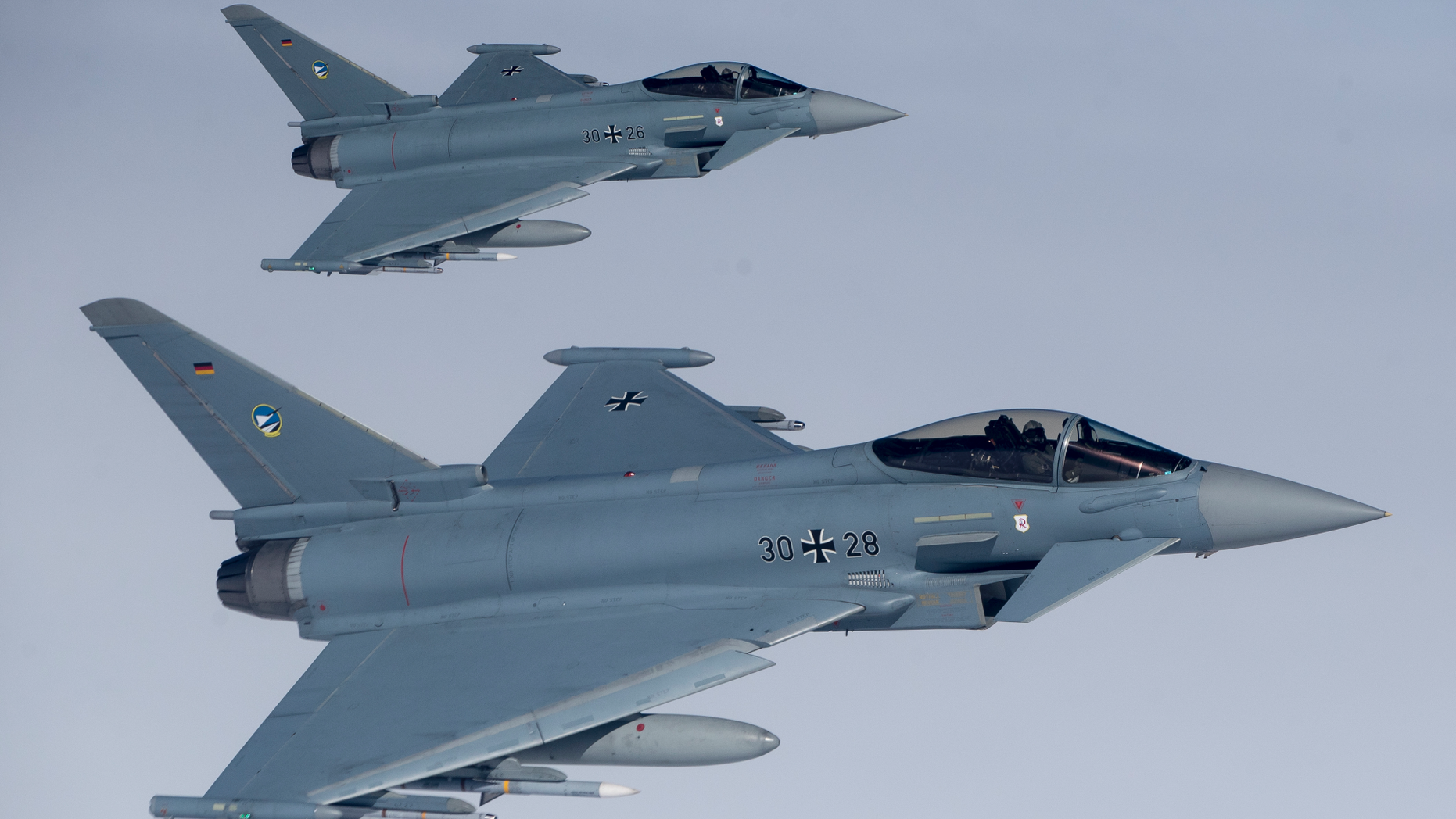 File -- In this Tuesday, April 25, 2017 photo German Eurofighter Typhoon fighter jets participate in NATO's Baltic Air Policing Mission operate in Lithuanian airspace during an air force exercise. Britain's top diplomat is demanding that Germany relax its ban on arms sales to Saudi Arabia because they are affecting UK sales of weapons to the oil-rich kingdom. (AP Photo/Mindaugas Kulbis, file)