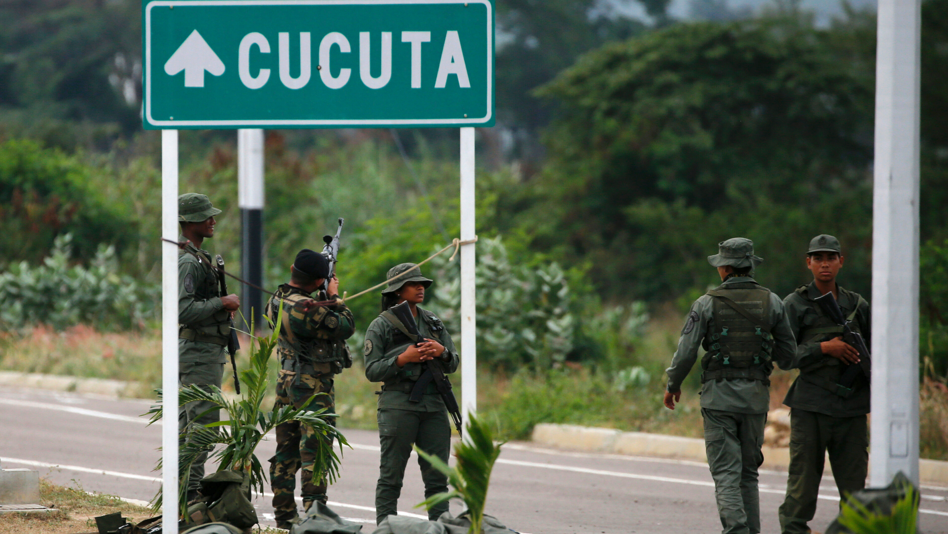 Venezuelan Bolivarian Army soldiers stand guard at the Tienditas International Bridge that links Colombia and Venezuela, near Urena, Venezuela, Friday, Feb. 8, 2019. As humanitarian aid kits were being packed into individual white bags in the city of Cucuta, just across the river from Venezuela, U.S. officials and Venezuelan opposition leaders appealed to the military to the let the aid through. (AP Photo/Fernando Llano)