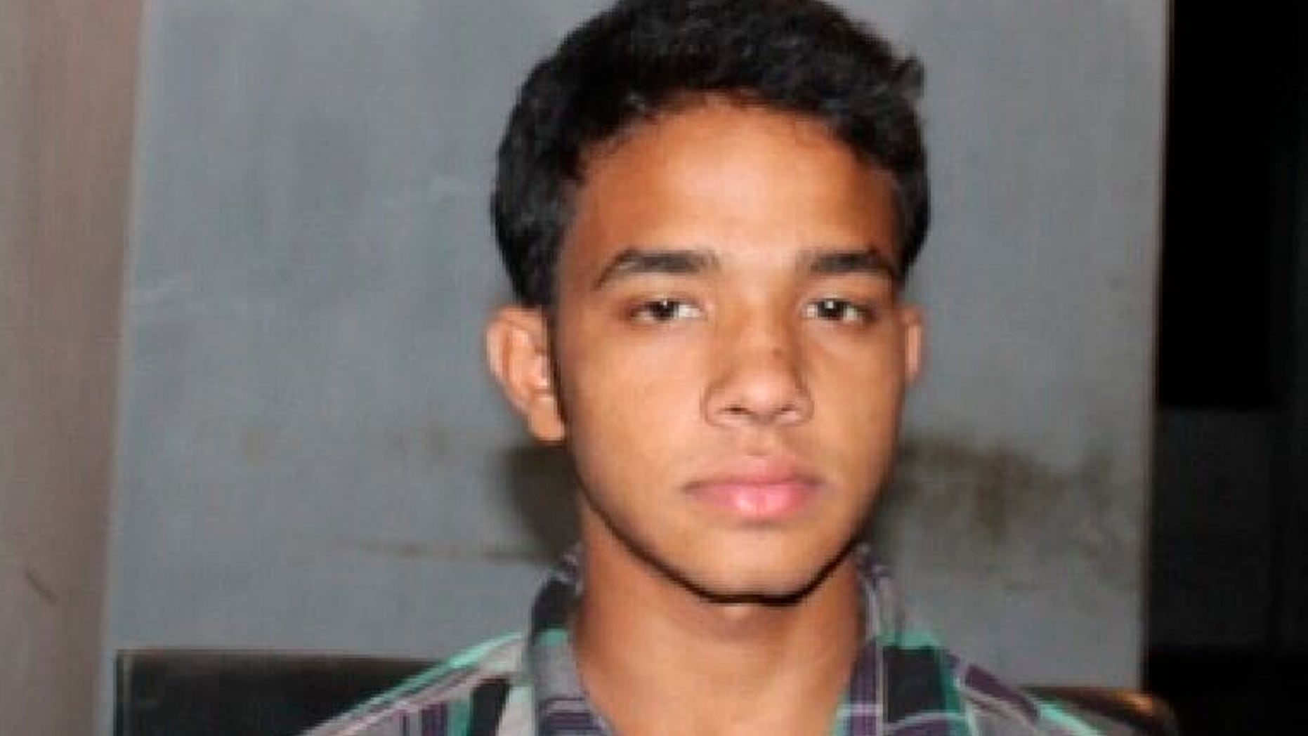 CORRECTS FIRST NAME This photograph released Monday by Bangladesh’s Rapid Action Battalion (RAB) from their criminal database shows Bangladeshi youth Mohammed Polash Ahmed who was arrested in 2012 by RAB in a kidnapping case. The man who was killed while trying to hijack a commercial flight in Bangladesh was a 24-year-old passenger from a village near the capital who may not have been armed, officials said Monday, in a reversal of previous allegations that he was carrying a pistol. ( Bangladesh’s Rapid Action Battalion via AP)